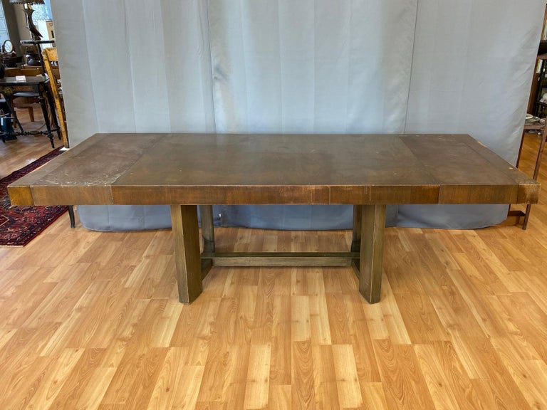 An early and substantial mahogany extendable dining table with leaves by T.H. Robsjohn-Gibbings for Widdicomb.

Notable for a distinctly American muscular yet stately Mid-Century Modern presence. Extra-thick top and base finished in Mahogany and