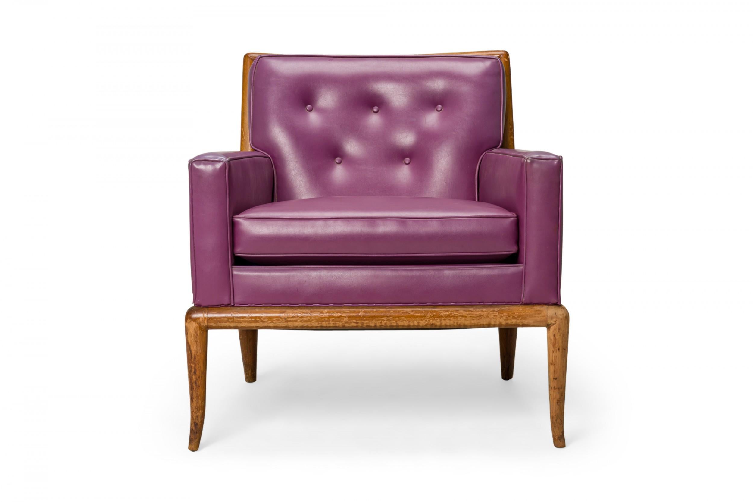 American mid-century lounge / armchair with a square walnut frame and purple vinyl upholstery with a button-tufted back, resting on four slightly curved and tapered walnut legs. (T.H. Robsjohn-gibbings for Widdicomb Furniture Co.).
    