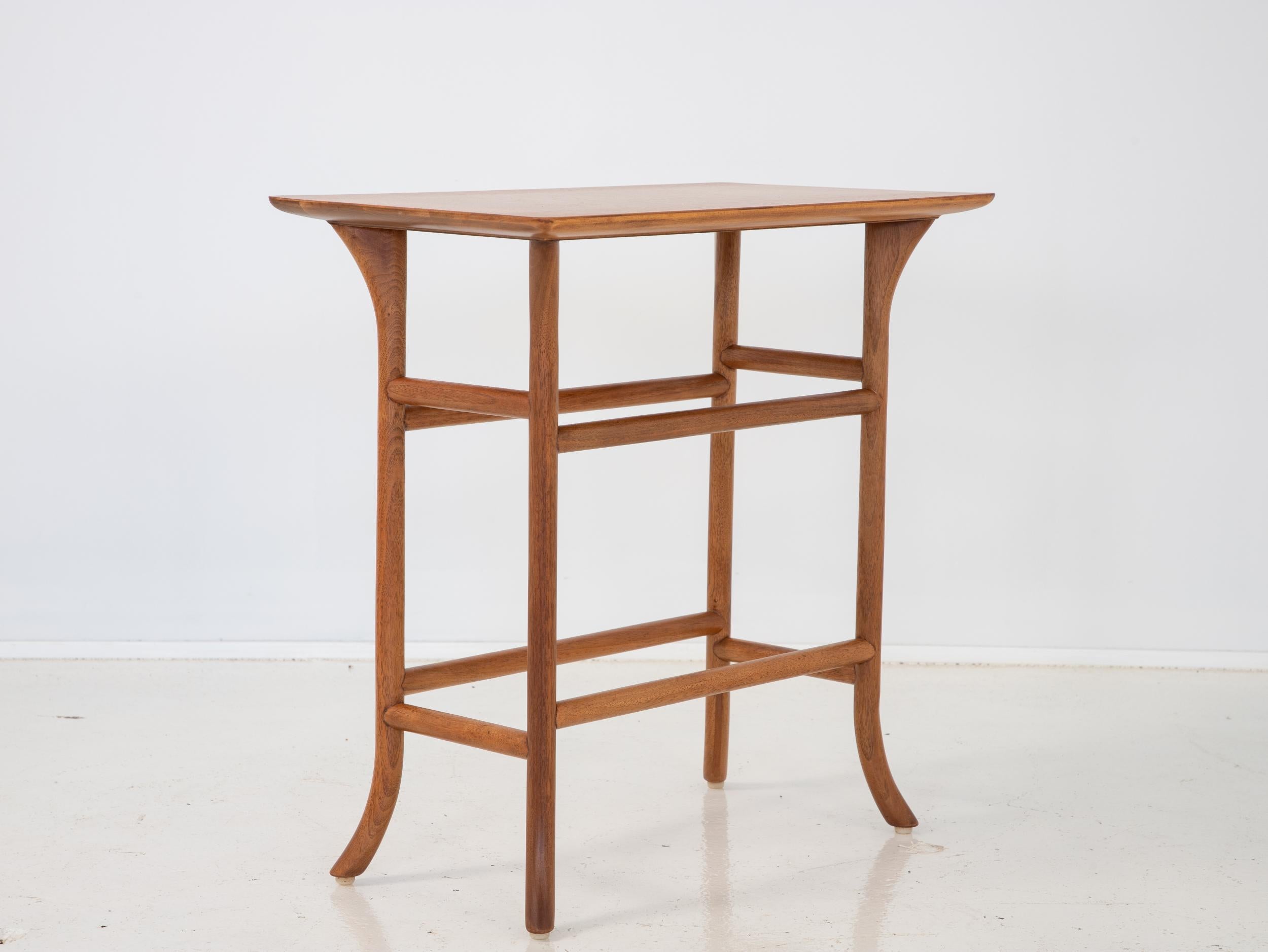 A refined drinks or side table, designed by T.H. Robsjohn-Gibbings for Widdicomb. A mid-century modern design with neoclassical influences, based in the designer's deep knowledge of classical furniture forms from Ancient Greece. Finely carved,