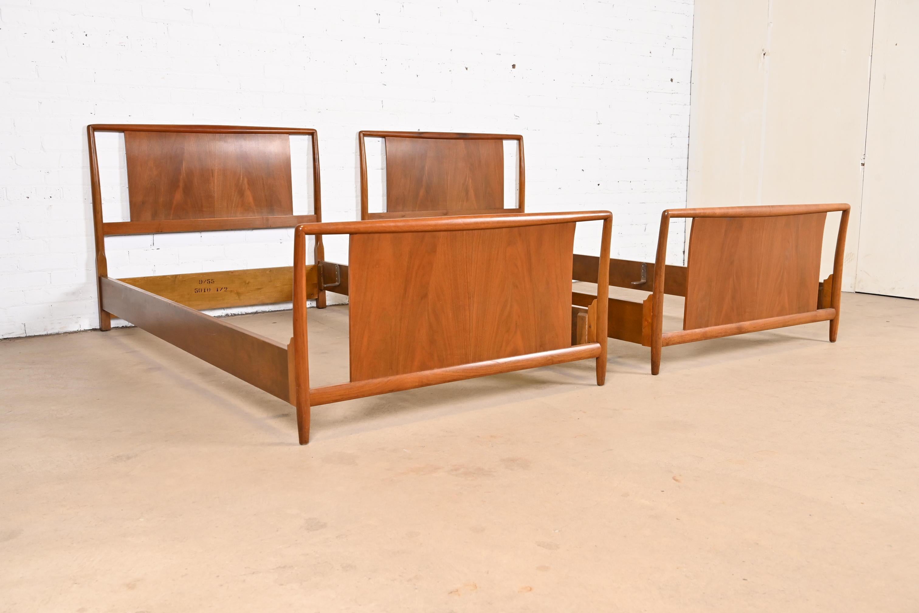 Mid-20th Century T.H. Robsjohn-Gibbings for Widdicomb Sculpted Walnut Twin Size Beds, Pair