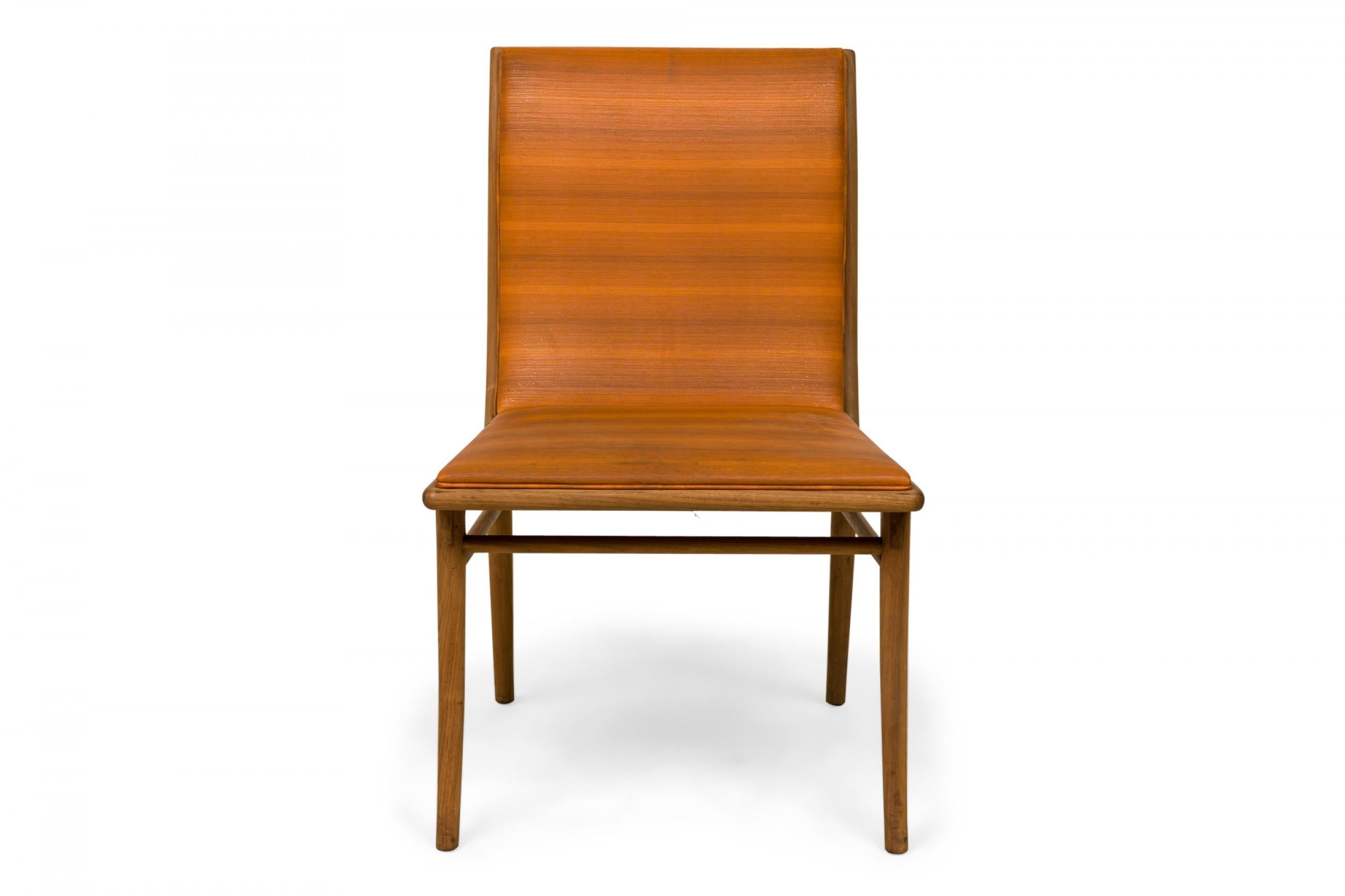 Mid-Century dining side chair with horizontally striped multi-tonal orange upholstery and a walnut frame with a curved slat back, resting on four tapered legs. (T.H. ROBSJOHN-GIBBINGS FOR WIDDICOMB FURNITURE COMPANY)

