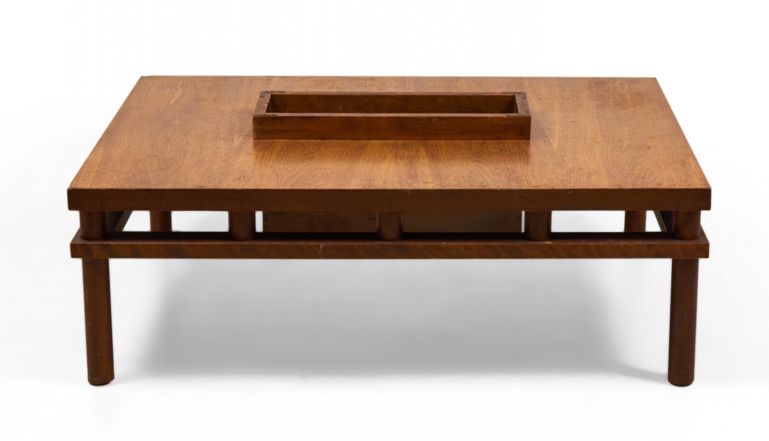 American mid-century rectangular walnut coffee table with removable central inset magazine box supported on four square walnut legs. (T.H. ROBSJOHN-GIBBINGS FOR WIDDICOMB FURNITURE COMPANY)