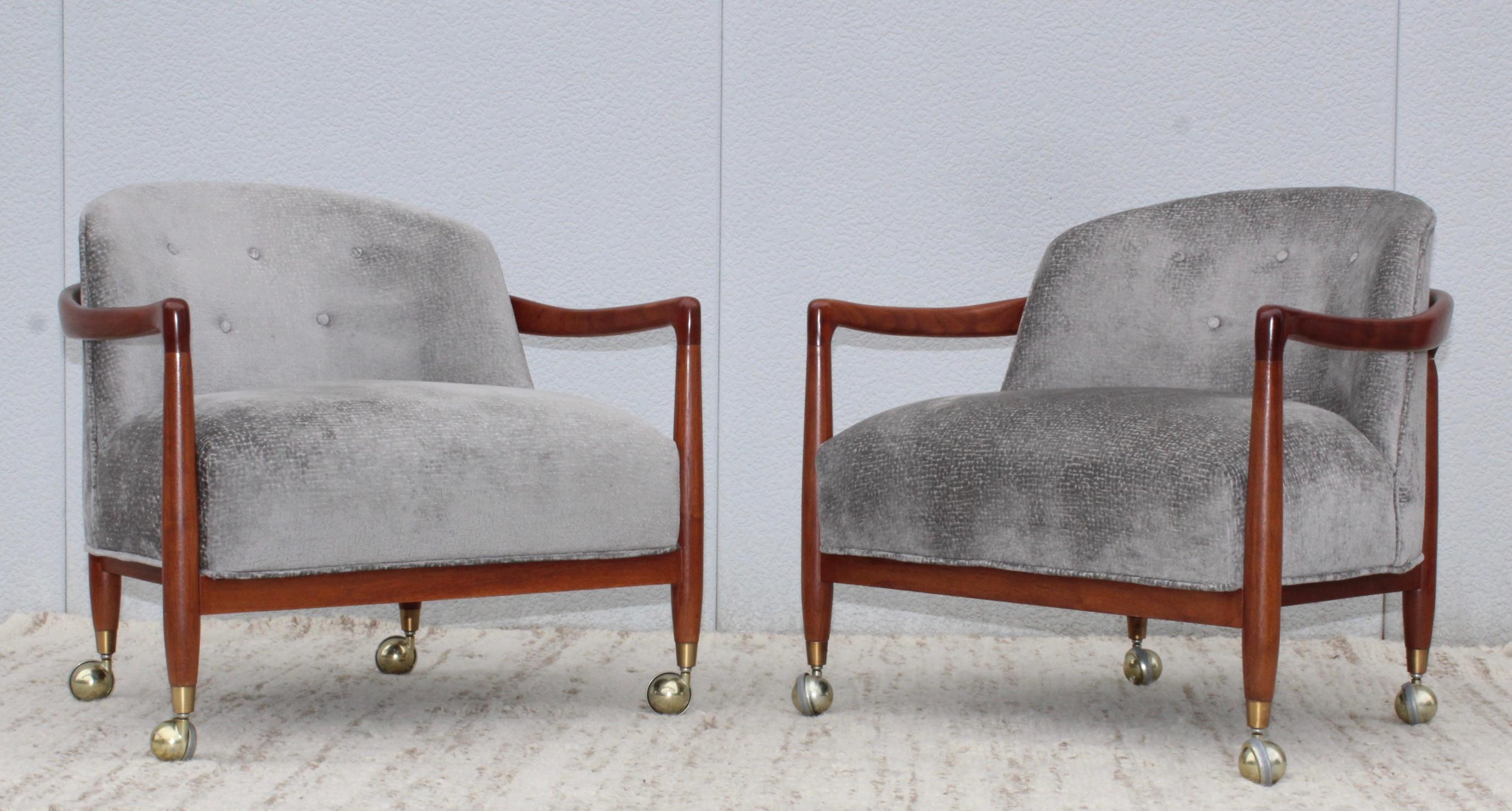 Stunning pair of 1960s Robsjohn-Gibbings designed for Widdicomb walnut lounge chairs on casters, refinished and newly reupholstered in velvet.