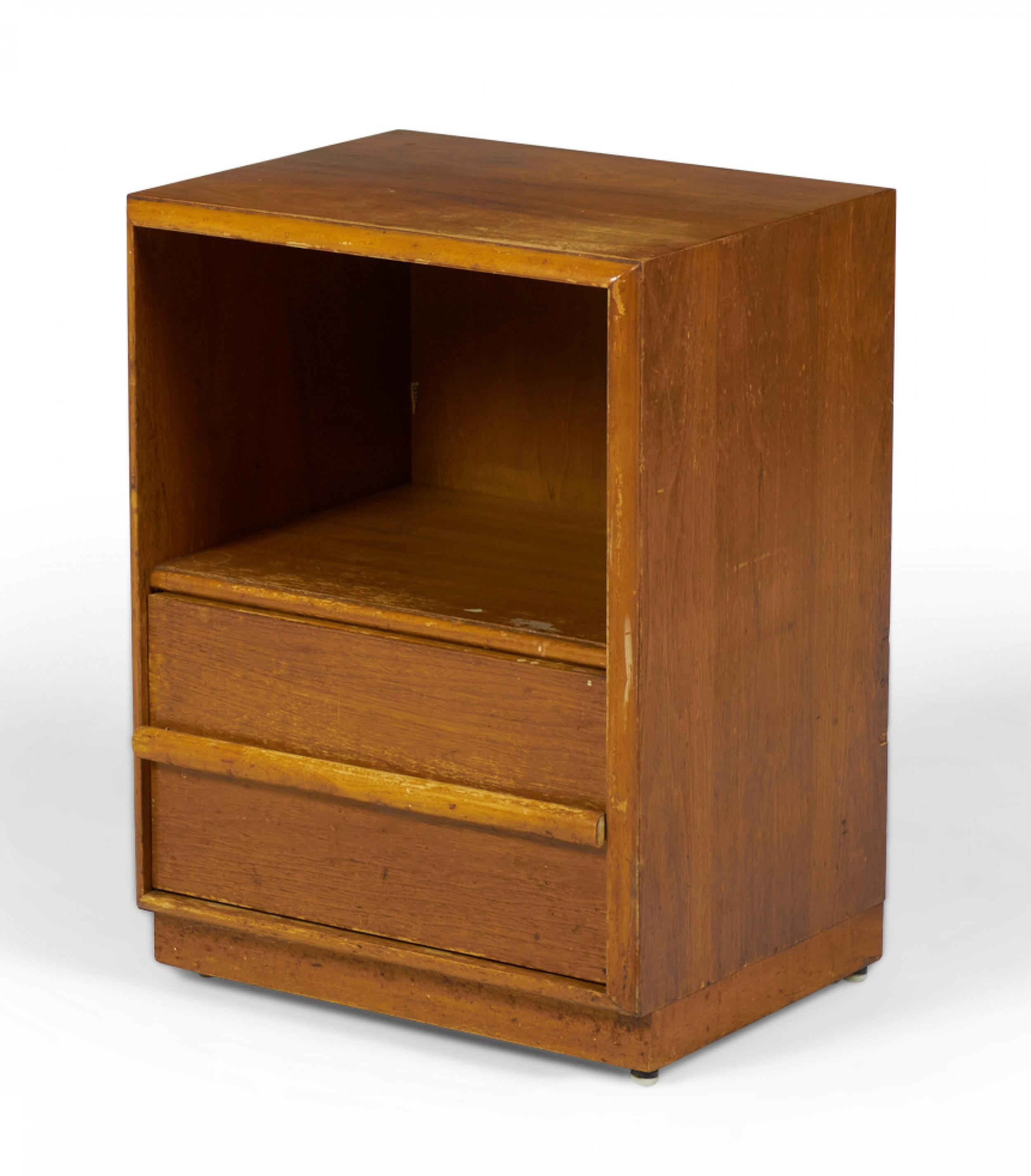 American Mid-Century walnut nightstand with an open upper cabinet shelf and a single lower drawer with a horizontal raised wooden drawer pull. (T.H. ROBSJOHN-GIBBINGS FOR WIDDICOMB)(Same piece with different finish: DUF0143B-C).