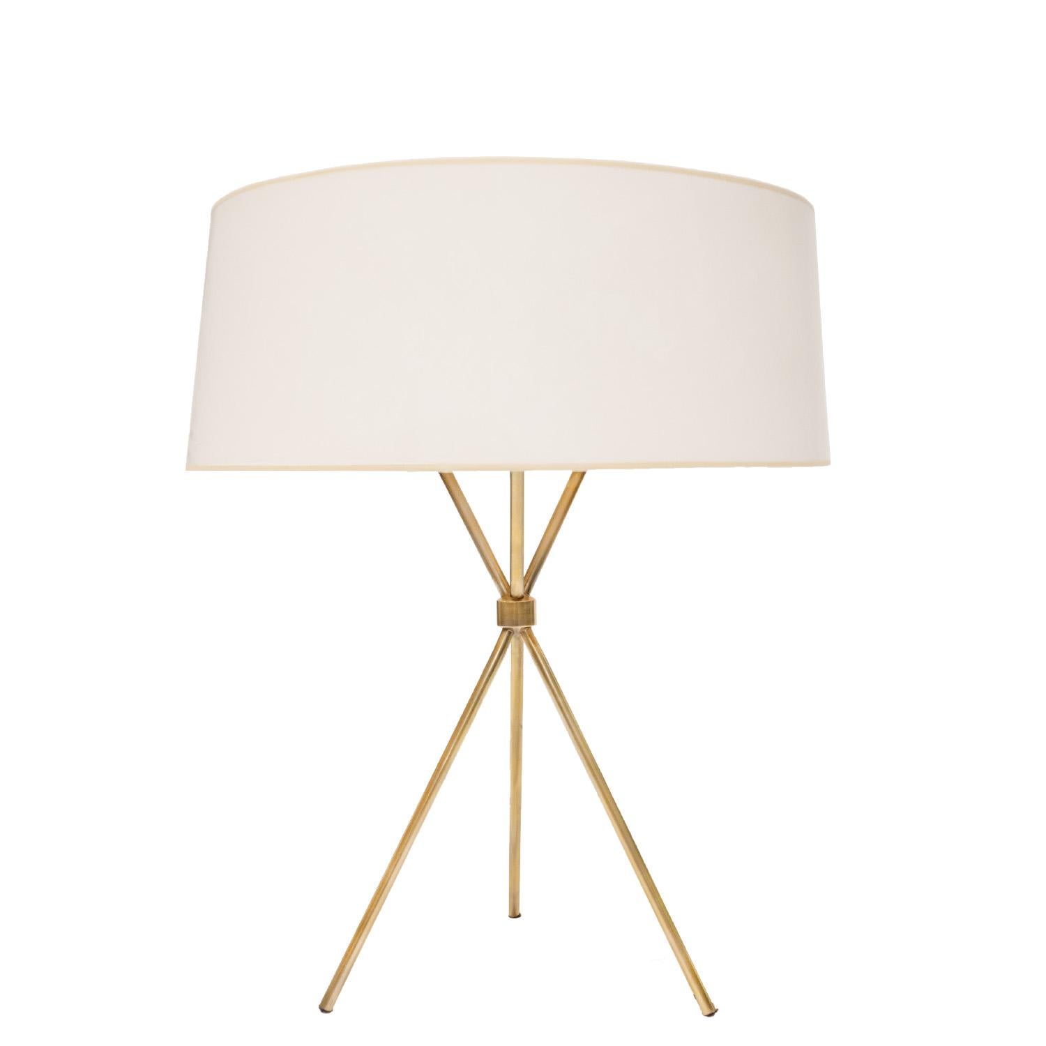 Tripod table lamp model no. 170 in brass with 3 bulbs and shade by T.H. Robsjohn-Gibbings for Hansen Lighting, American 1960's.  This lamp has been rewired with a silk cord.  A timeless mid-century design by one of it’s greatest