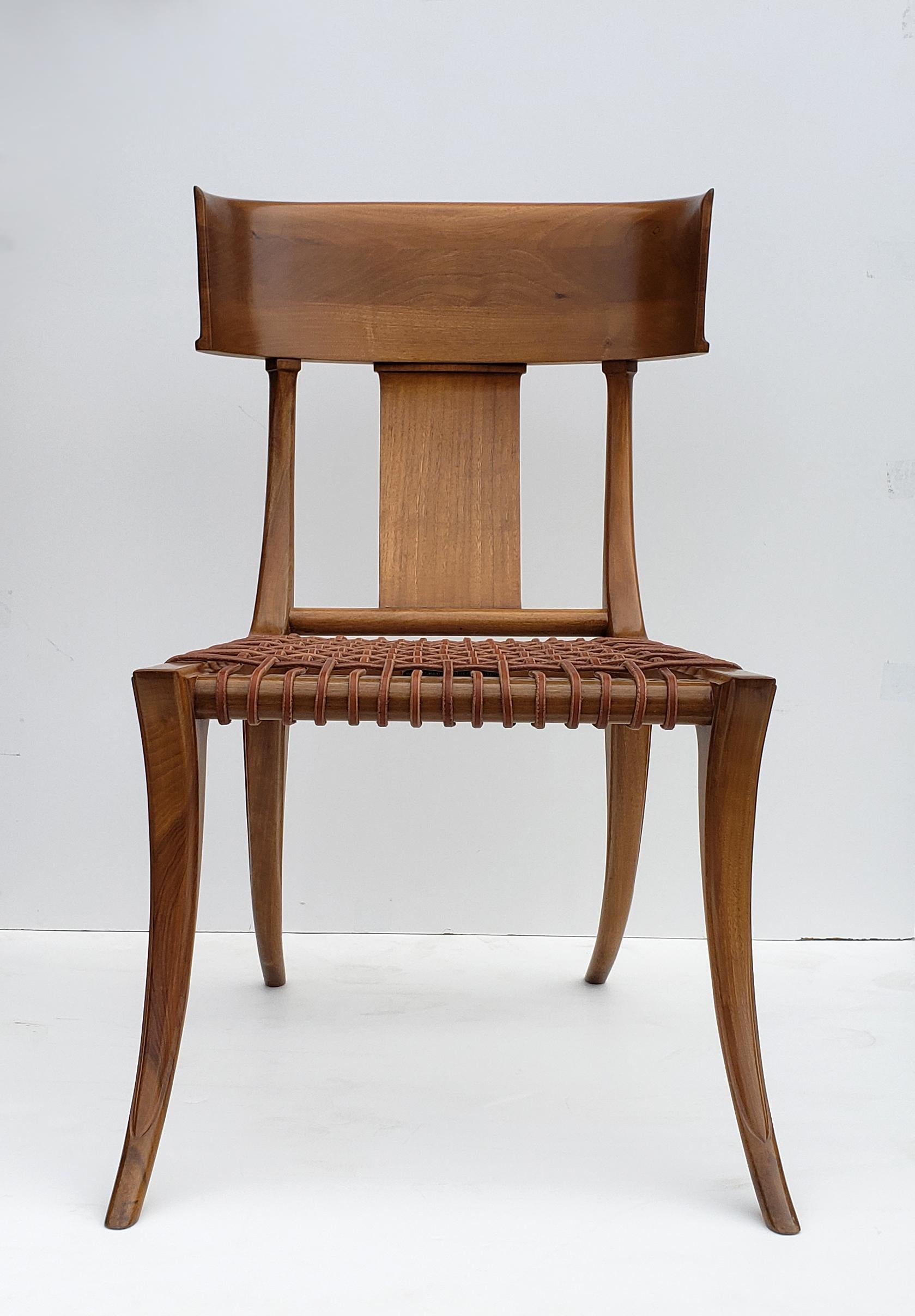 A masterpiece of 20th century design. The T.H. Robsjohn-Gibbings designed Klismos chair produced in Greece by Saridis of Athens. This example retains the original metal plaque and is stamped with a unique serial number by the manufacturer. Excellent