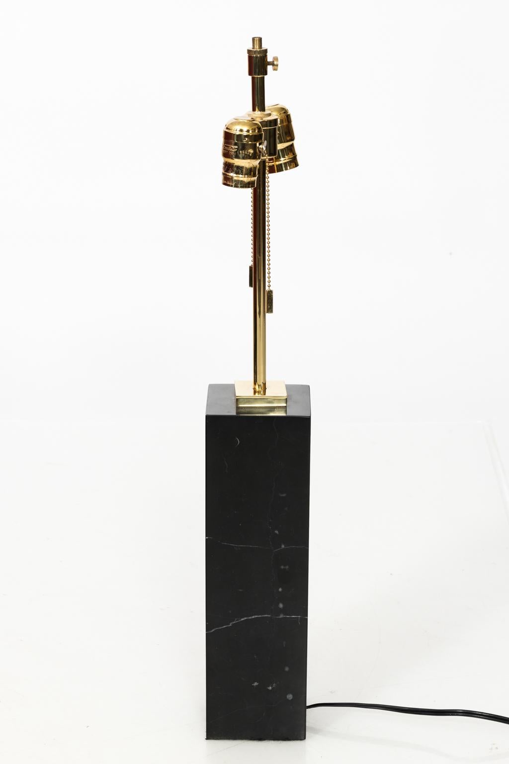 Mid-Century Modern style lamp by T.H. Robjohn Gibbings with black marble base. Shade not included, circa 1950s.