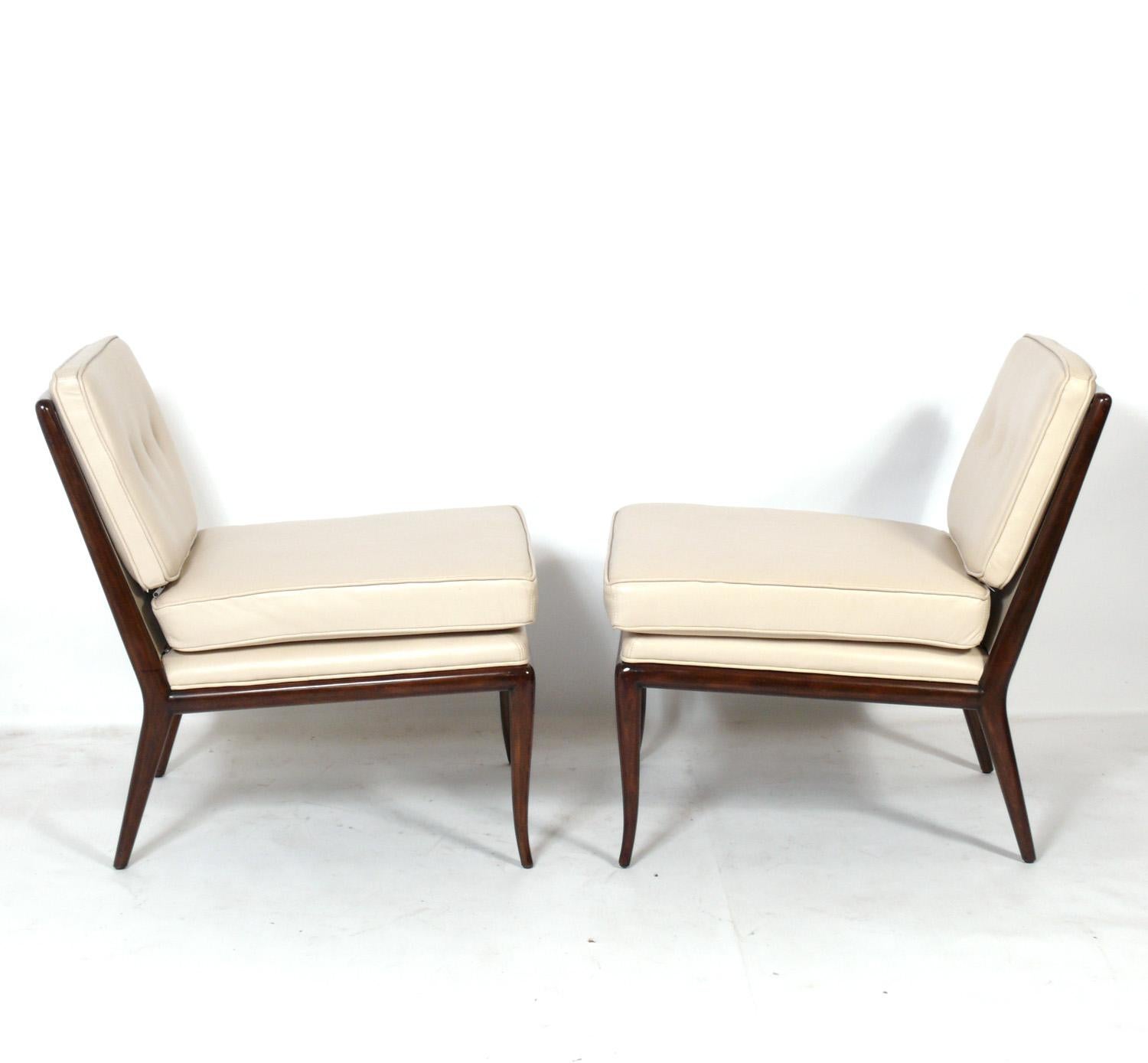 Elegant leather slipper lounge chairs, designed by T.H. Robsjohn Gibbings for Widdicomb, American, circa 1950s. They have been refinished and reupholstered in leather.