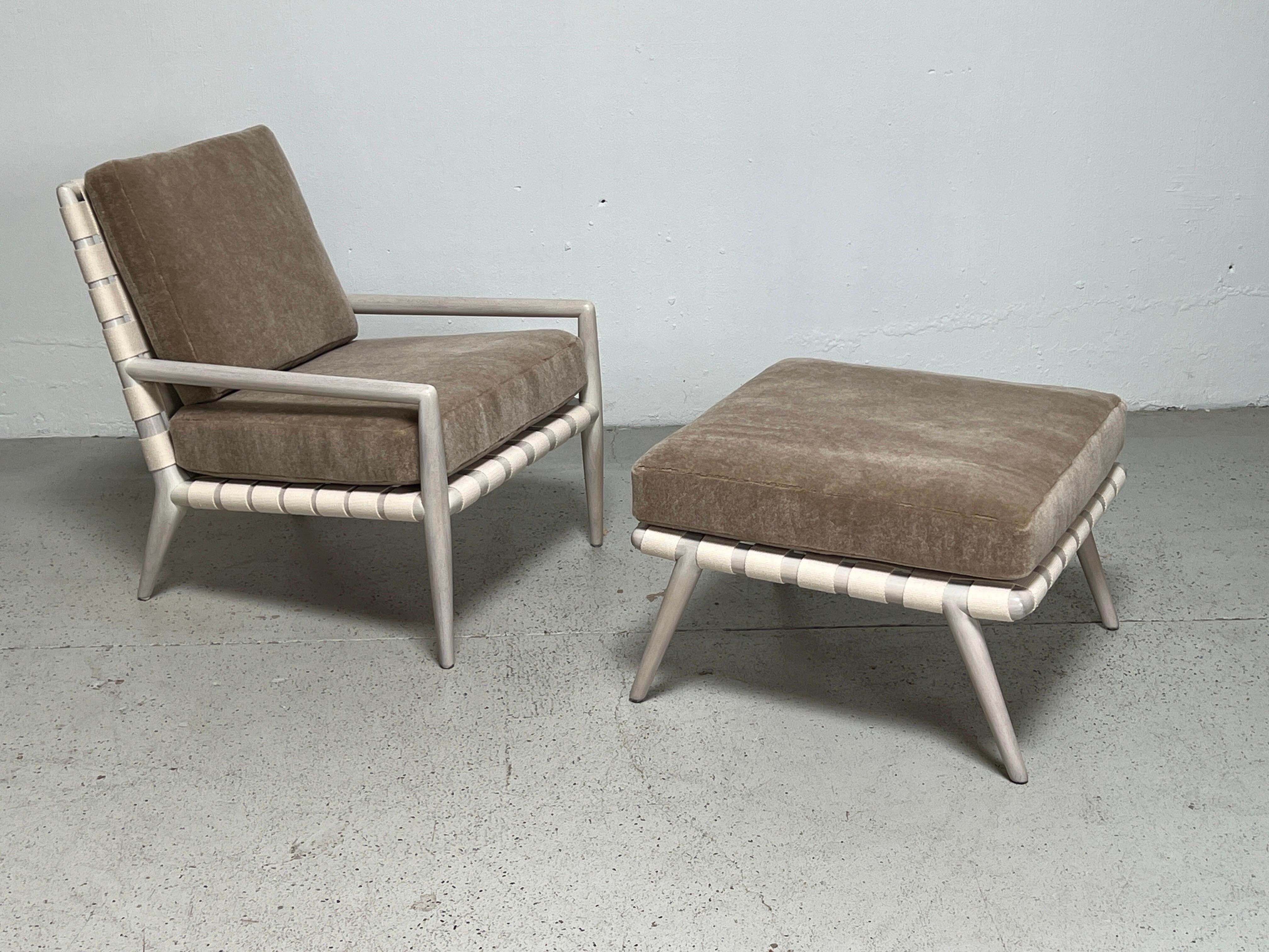 A T.H. Robsjohn-Gibbings for Widdicomb lounge chair and ottoman with cloth straps, white-washed frame and mohair upholstery. 