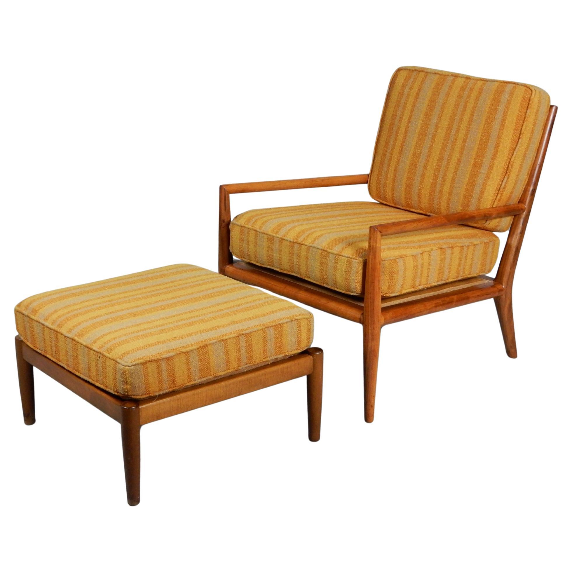 Elegant modern lounge chair designed by T.H. Robsjohn-Gibbings for Widdicomb, circa 1950s. Mated with a different manufactured but matching ottoman. Both are solid walnut wood frames with Jack Lenor Larson style striped weave upholstery. No repairs