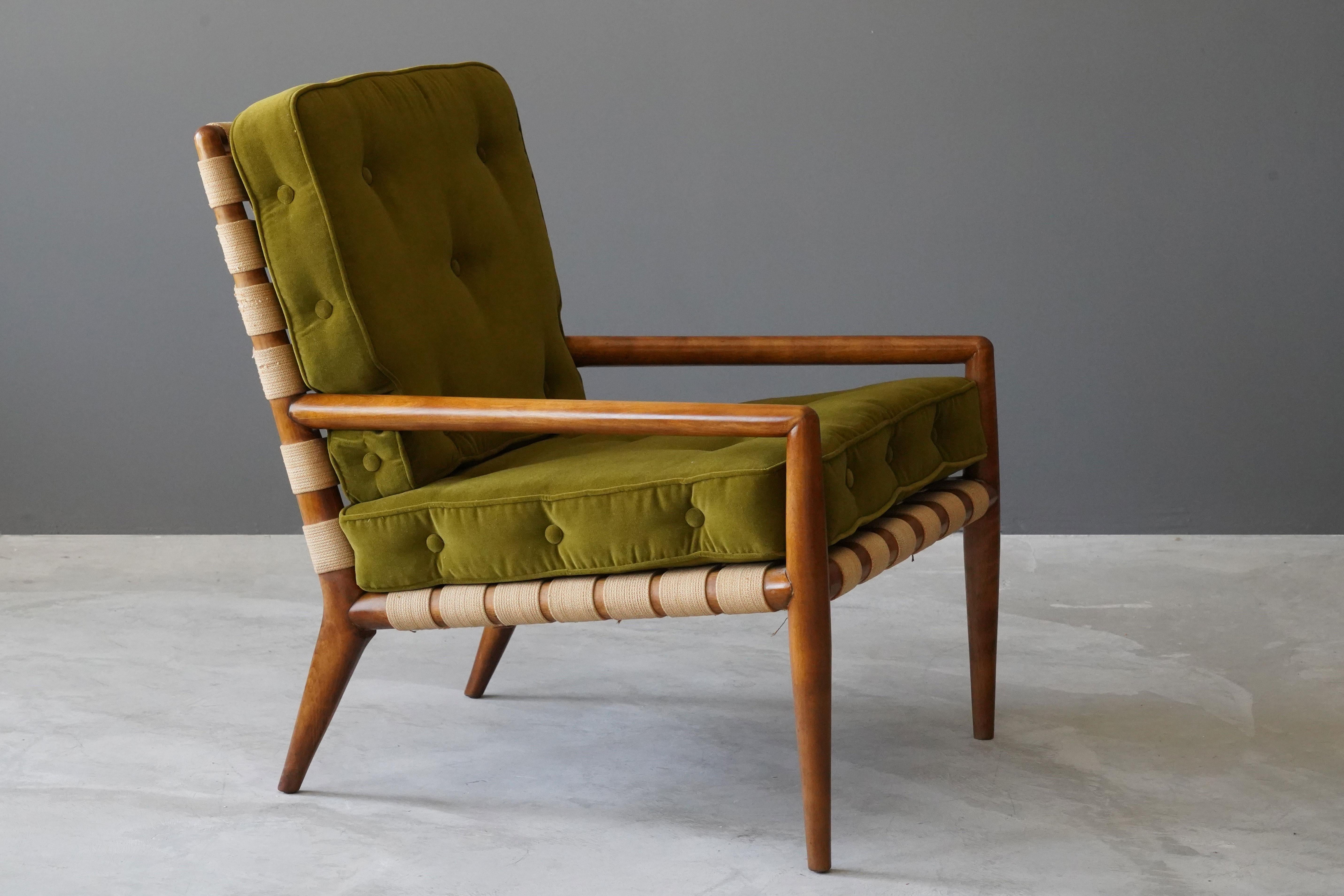 A lounge chair / armchair designed by T.H. Robsjohn-Gibbings. Produced by Widdicomb Furniture Company in Grand Rapids, Michigan, circa 1950s. Executed in walnut, original webbing, seat cushions with brand new high-end velvet upholstery.