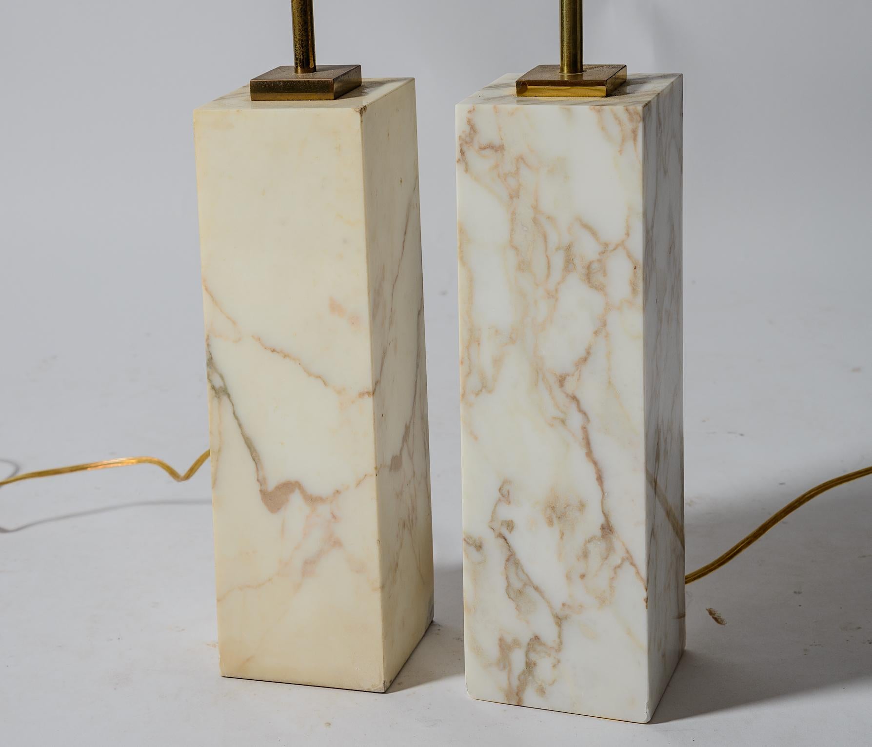 A pair of TH Robsjohn -Gibbings Marble Table Lamps.
Manufacctured by the Hansen Lamp Company.
Original brass lamp fittings and finials
Attractive veining in Marble