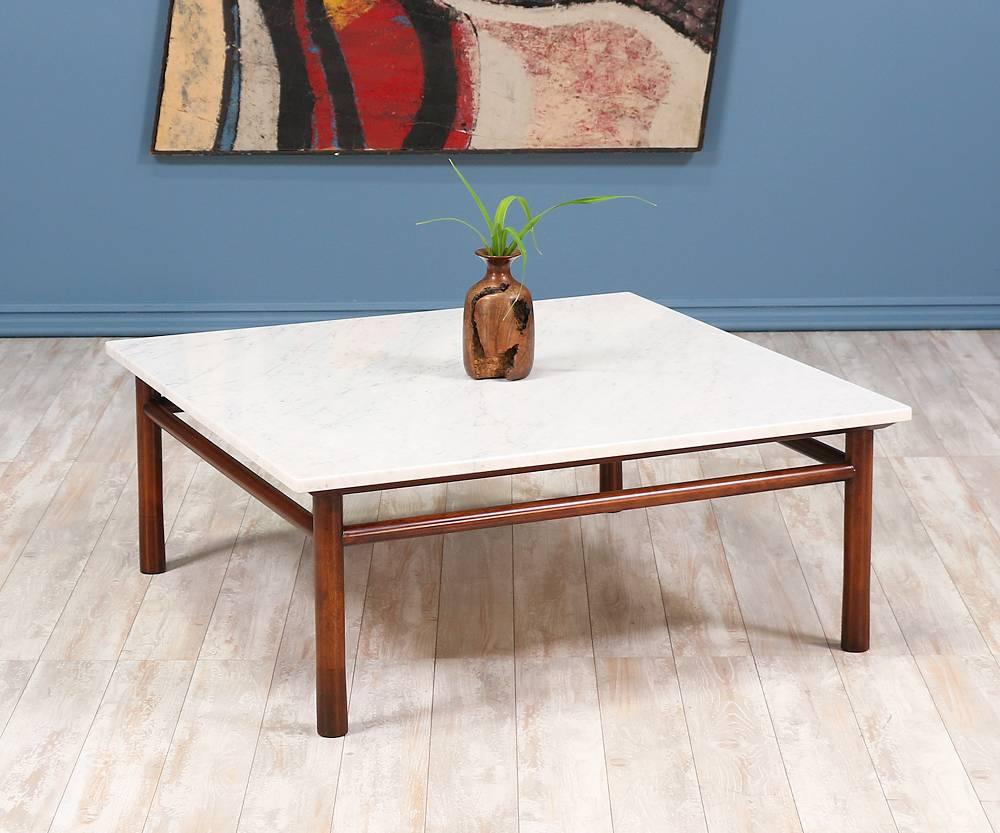 Minimalist coffee table designed by T.H. Robsjohn-Gibbings for Widdicomb Furniture Company in the United States circa 1950’s. The simplicity of this design and the use of geometric shapes represents Robsjohn-Gibbings elegant and timeless aesthetic.