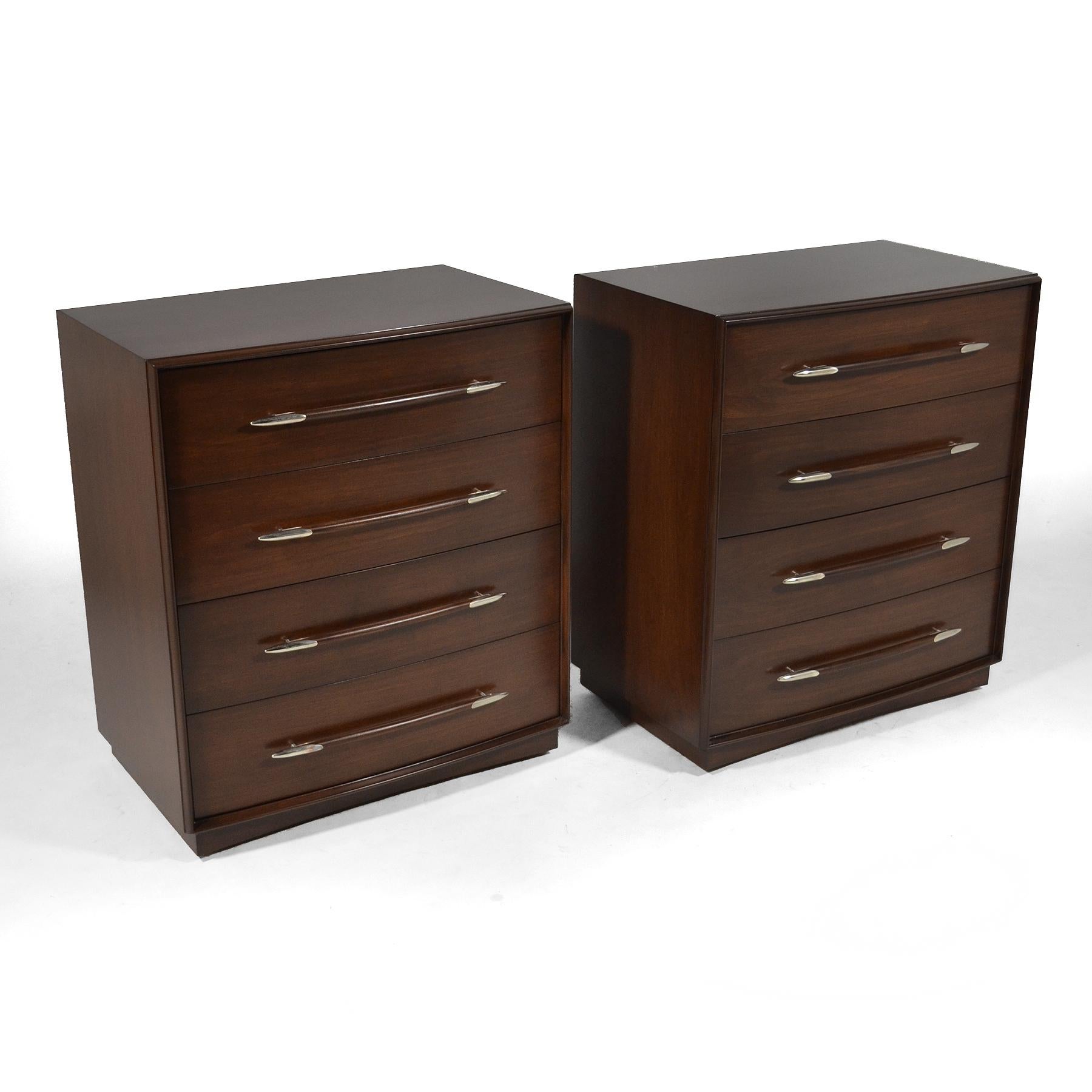 These stunning dressers by T.H. Robsjohn-Gibbings for Widdicomb are impeccably designed and expertly crafted. The walnut cases have been restored with a dark, rich finish and the elegant spear-shaped pulls polished to a beautiful luster.

        