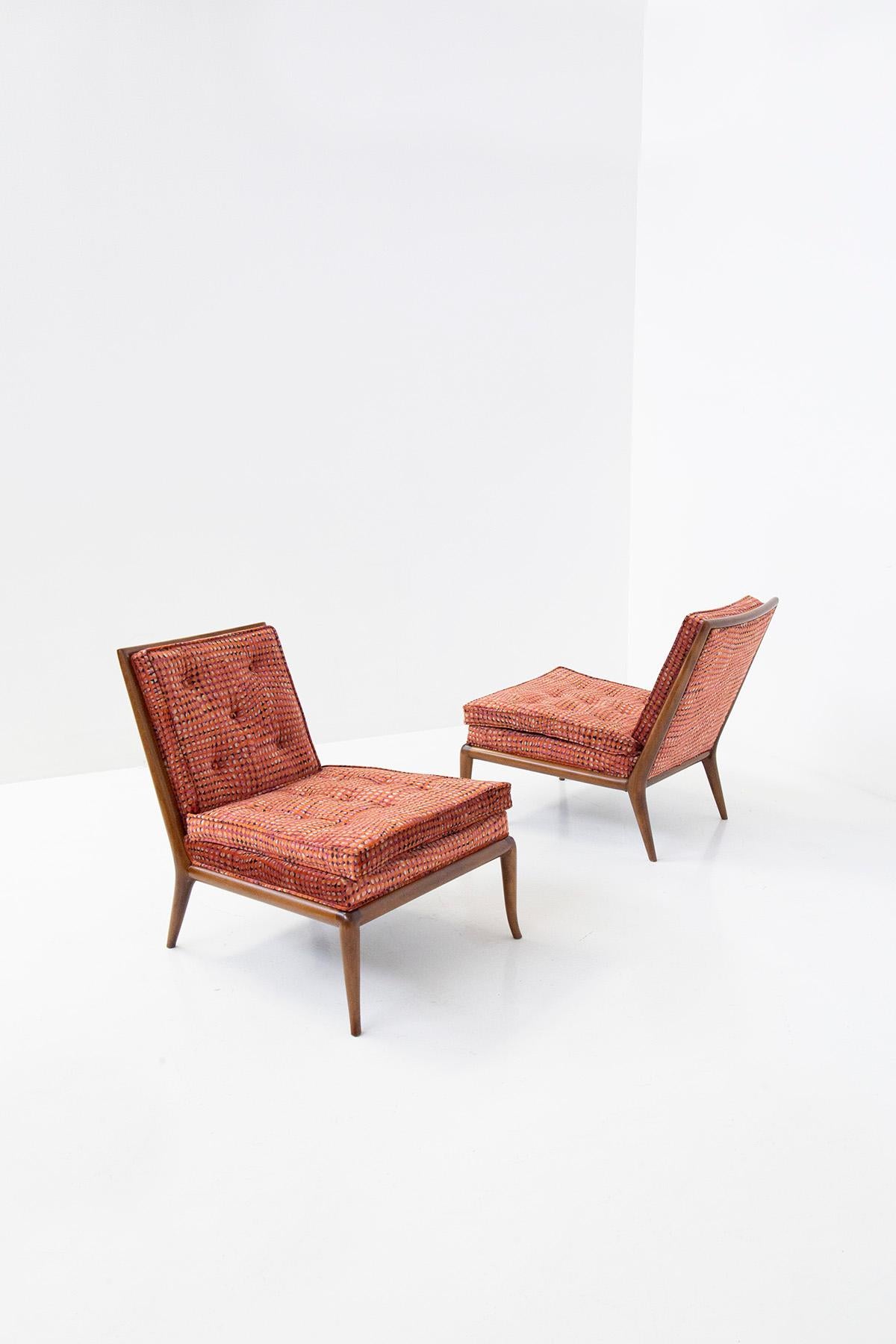 Great classic taste by U.S. designer T.H. Robsjohn-Gibbings. The pair of armchairs are from the 1950s, restored and refreshed in spectacular fabric. The new upholstered cushions provide excellent seating comfort.We note that the seat is made with a