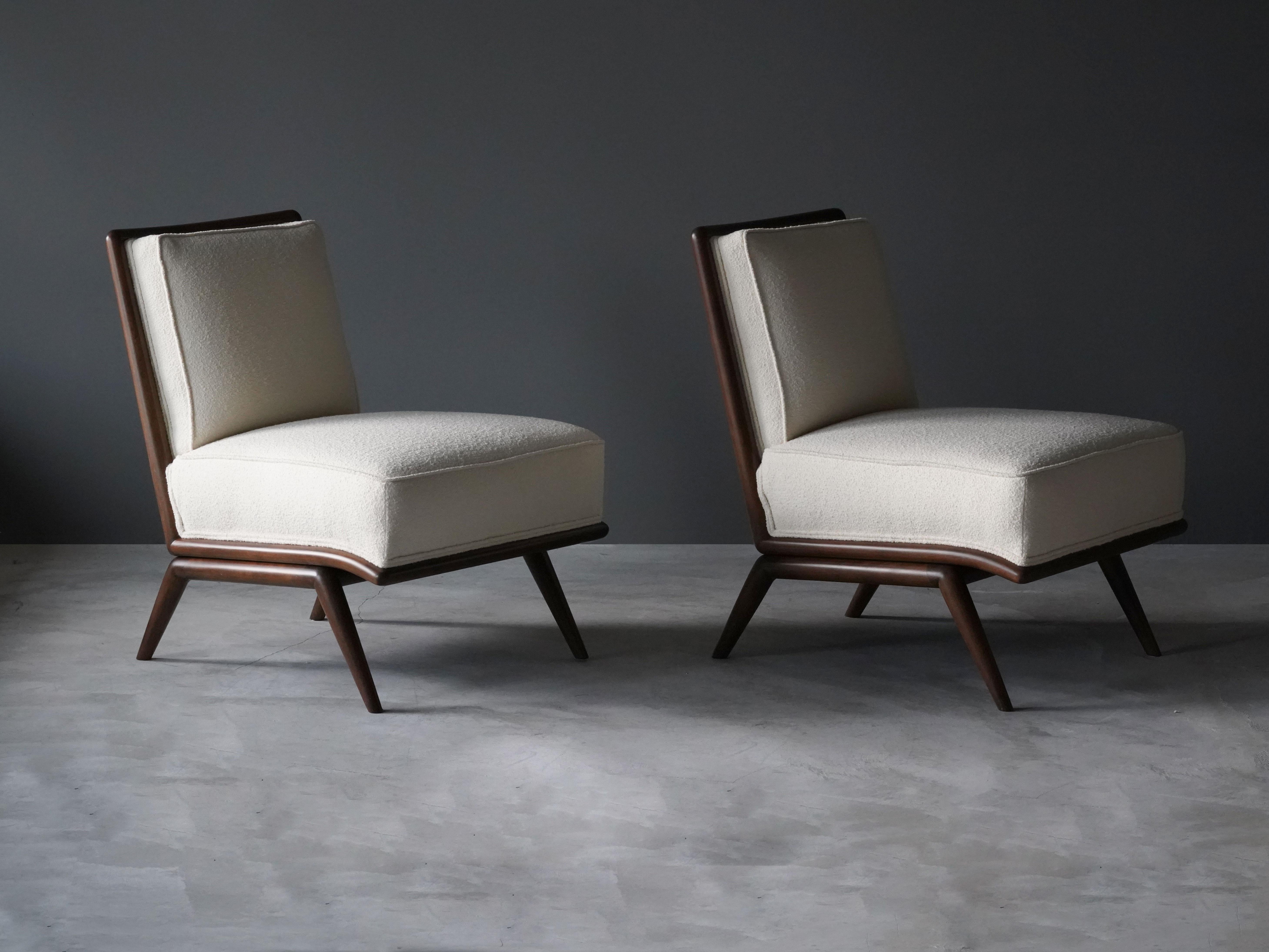A pair of rare slipper chairs designed by T.H. Robsjohn-Gibbings. Produced by Widdicomb Furniture Company in Grand Rapids, Michigan, circa 1950s.

The curvlinear form gives this Robsjohn-Gibbings design a Modern expression. 

