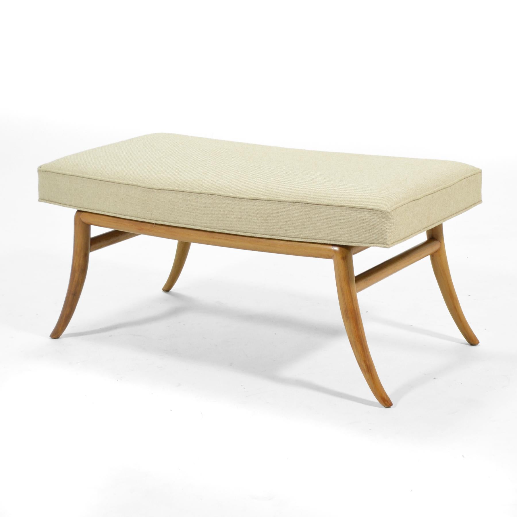 We think this design by T.H. Robsjohn-Gibbings perfectly reflects the designer's character: refined, elegant, and sophisticated. The model 2021 features his distinctive saber leg to support a simple upholstered bench– perfect for the foot of the