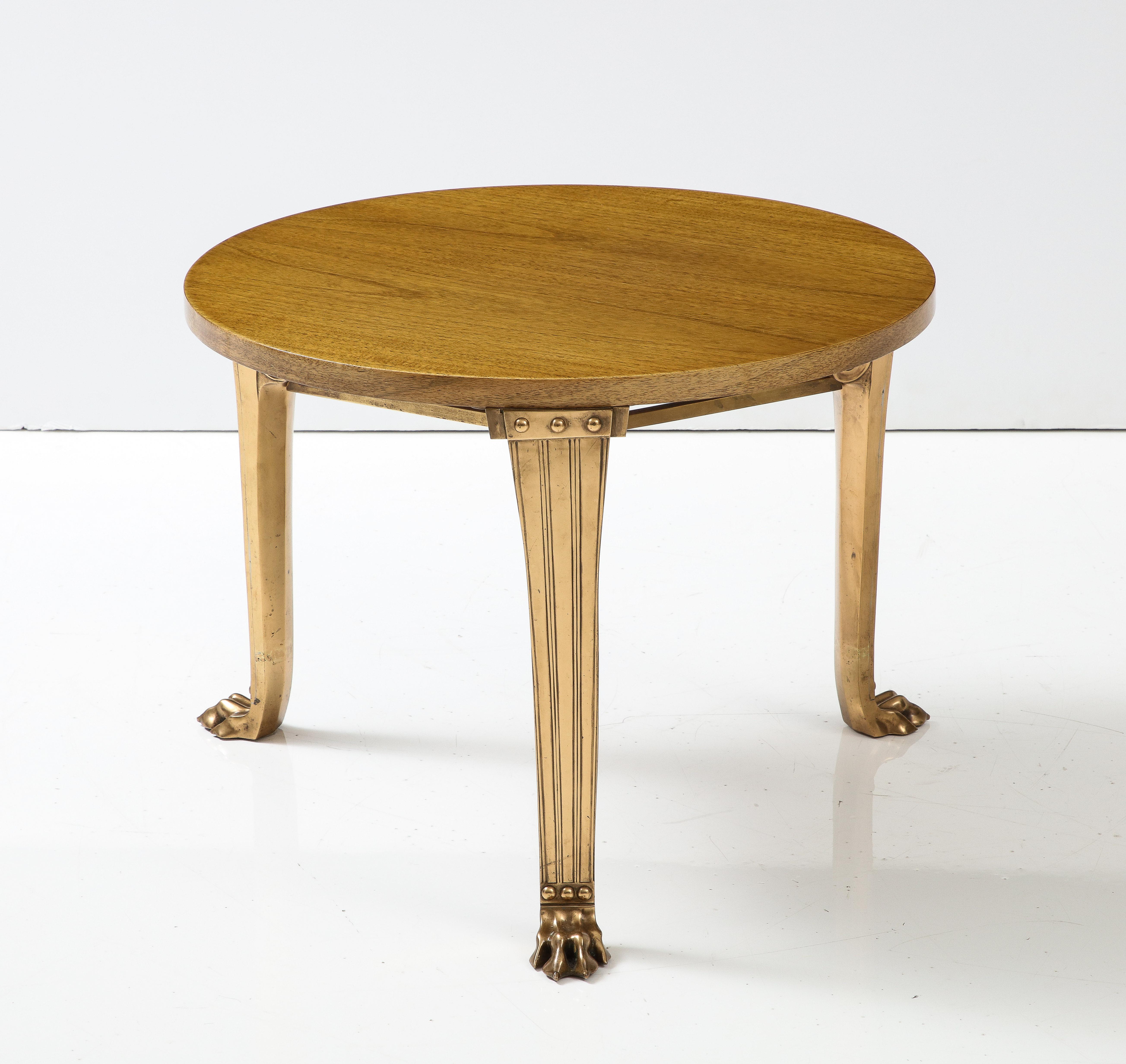 T.H. Robsjohn Gibbings Saridis of Athens Tripod Walnut Table, Polished Bronze Lion Claw Foot Legs with Scrolling Details, c 1960, signed, numbered

H: 19.5 Diam. 26.25 in.