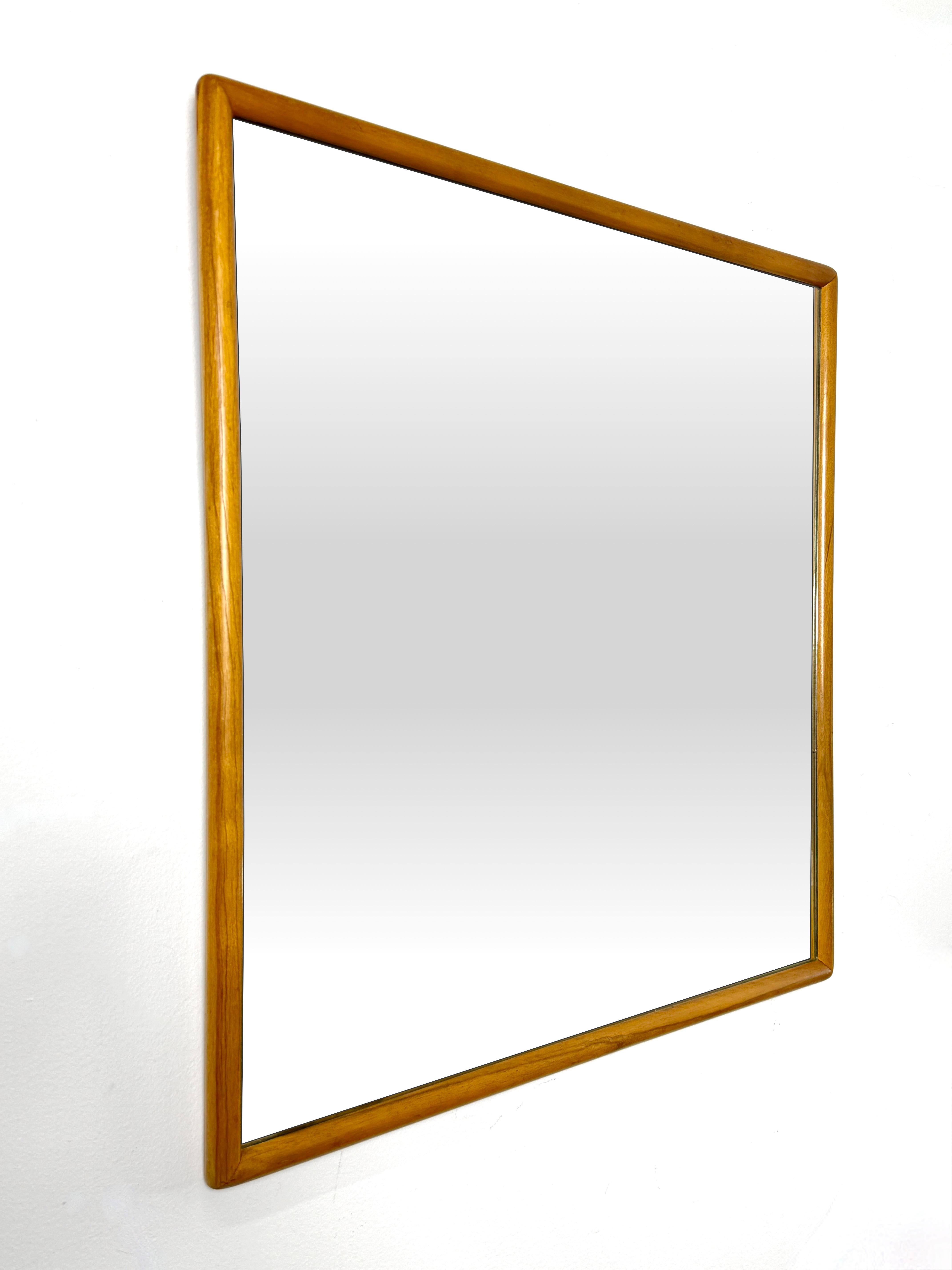Minimalist solid walnut squared wall mirror designed by T.H. Robsjohn Gibbings for Widdicomb in 1952

Model 1741 features a sculpted walnut frame with gently contoured edges that surround the mirror for a perfect balance of simplicity and