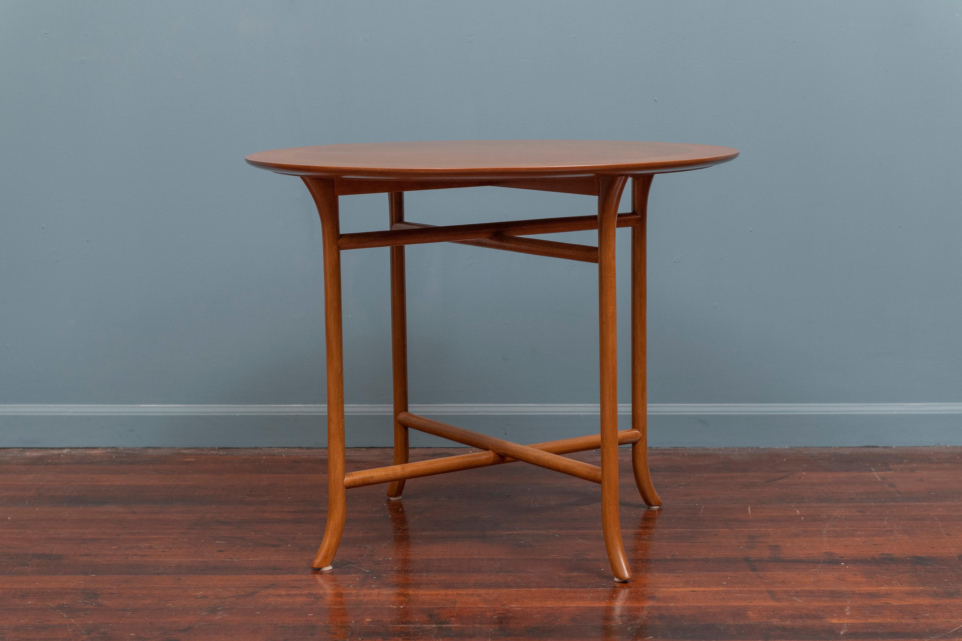 T.H. Robsjohn-Gibbings design sofa or side table for Widdicomb, U.S.A. Newly refinished with a circular banded and sculpted edge top on a lovely splayed leg base, labeled.