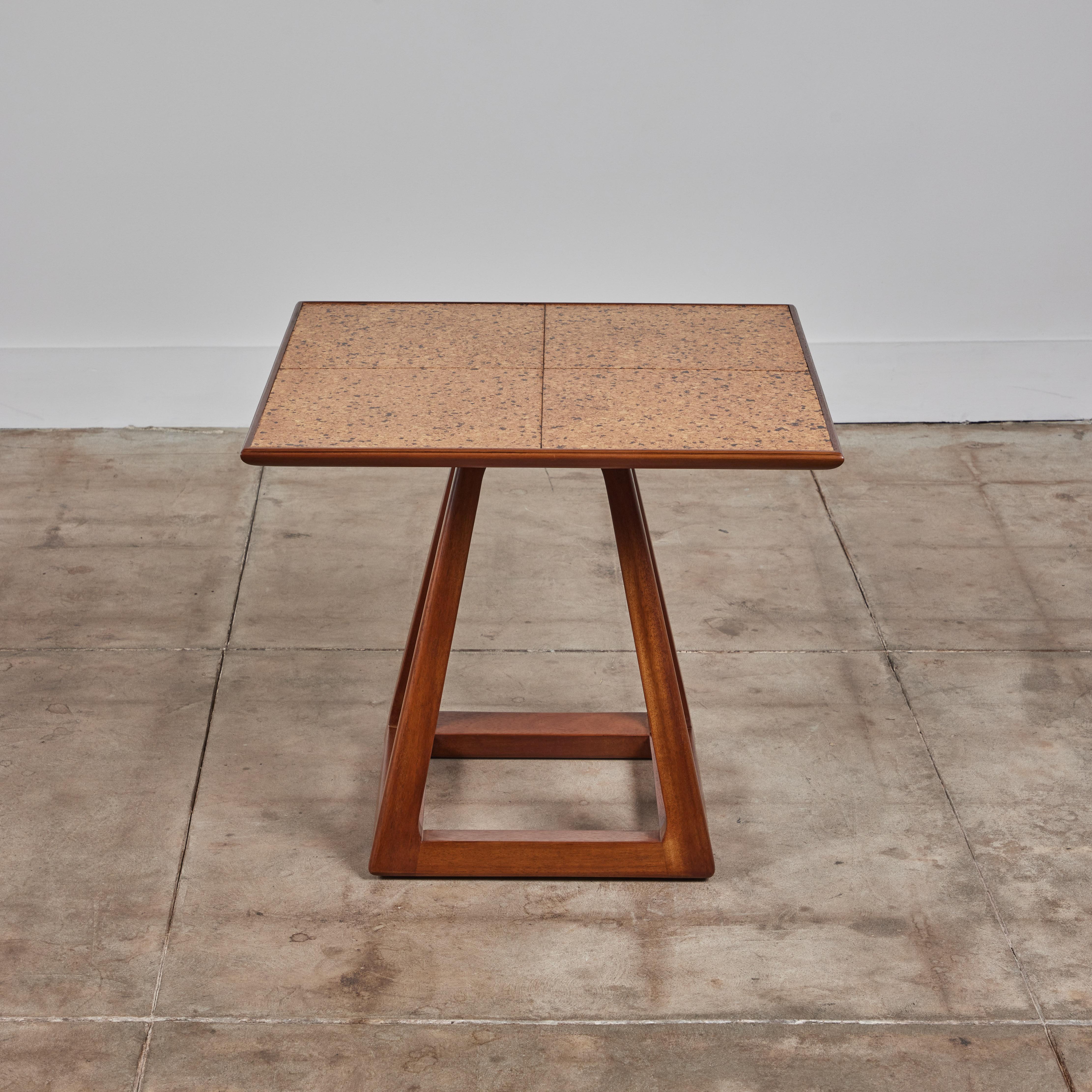 Side table by T.H Robsjohn Gibbings, manufactured by Widdicomb, c.1950s, USA. The mahogany table features a square inlayed cork table top. It is supported by an open square pedestal base. Marked Widdicomb on the underside.

Dimensions
24.75