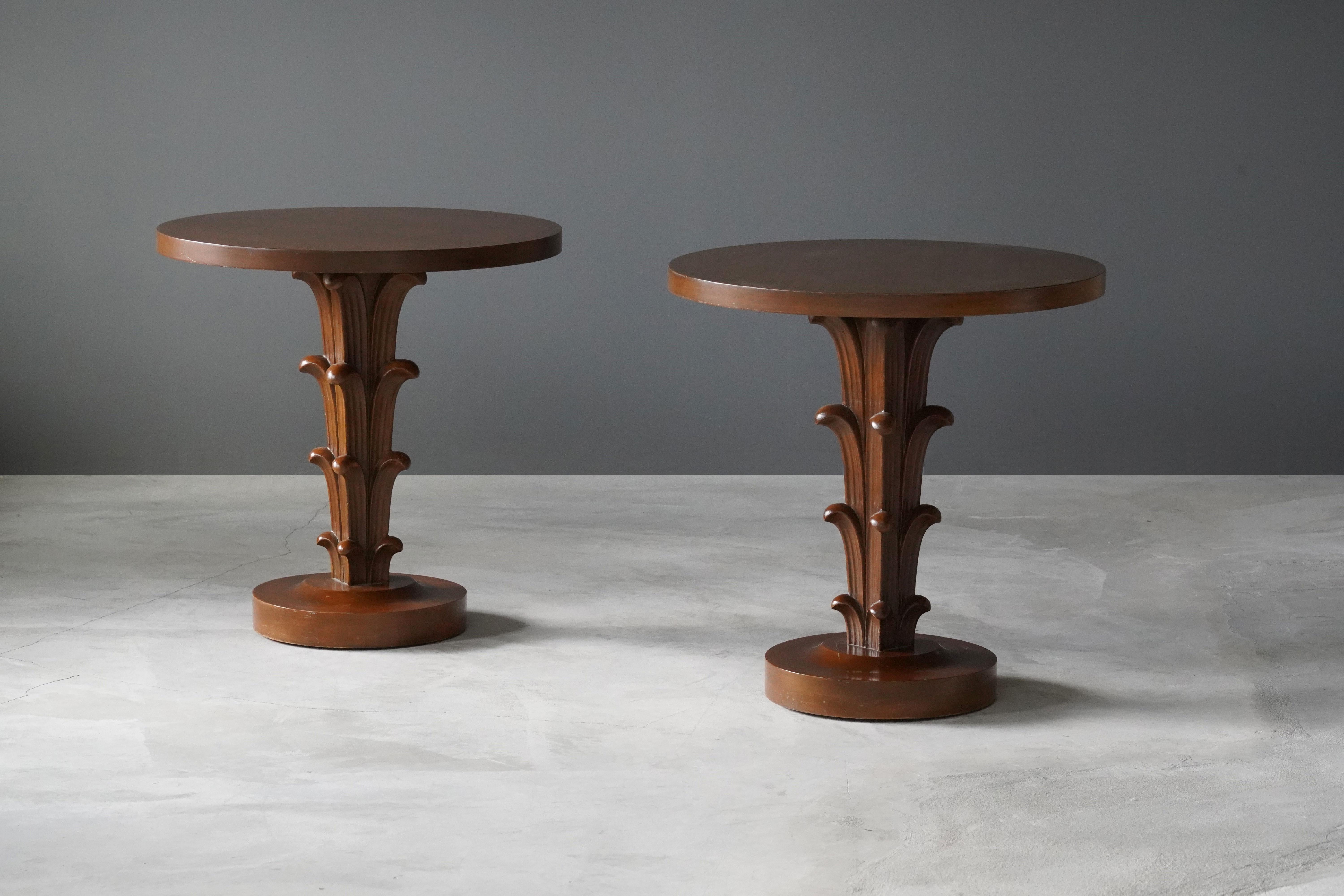 A rare pair of side tables / end tables / occasional tables. Designed by British / American designer T.H. Robsjohn-Gibbings. Produced by Widdicomb Furniture Company, Grand Rapids, Michigan. Bears stencil marking from Widdicomb aswell as retail