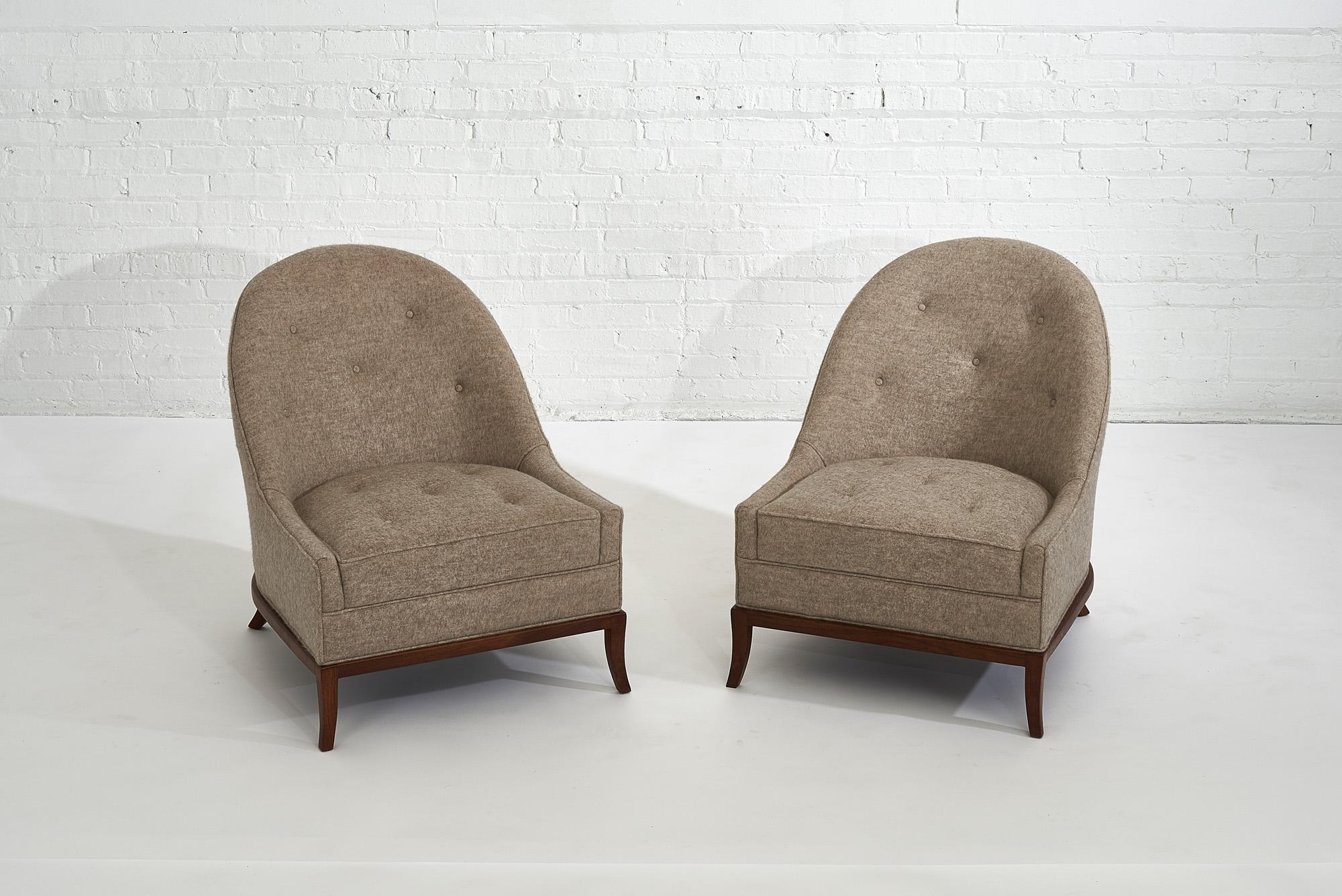 T.H. Robsjohn-Gibbings slipper lounge chairs for Widdicomb, model 2043. Refinished walnut bases with alpaca upholstery.