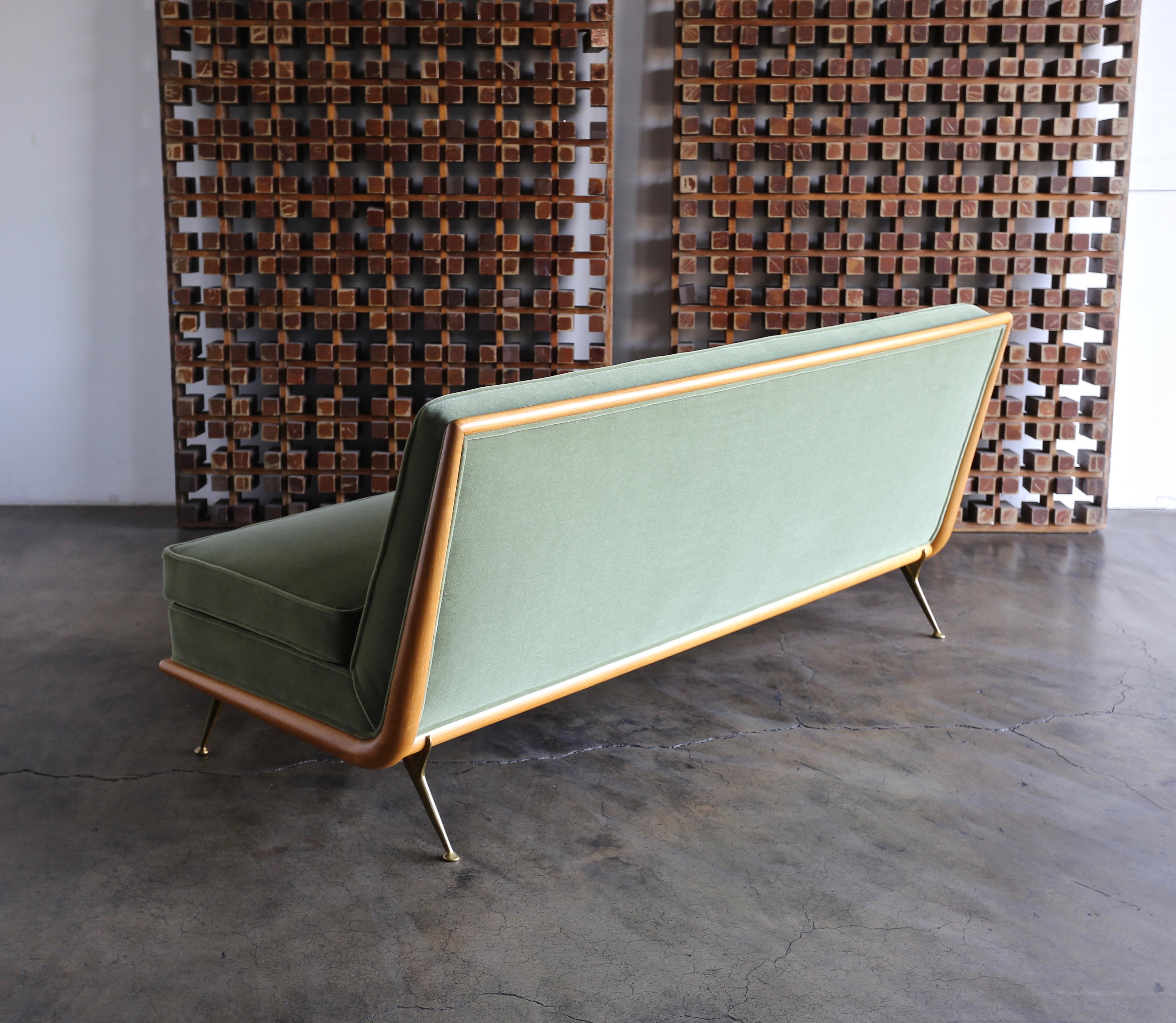T.H. Robsjohn-Gibbings sofa, Model 1727 for Widdicomb, circa 1955. This piece has been professionally restored. The upholstery is Maharam Mohair Supreme: Sage.