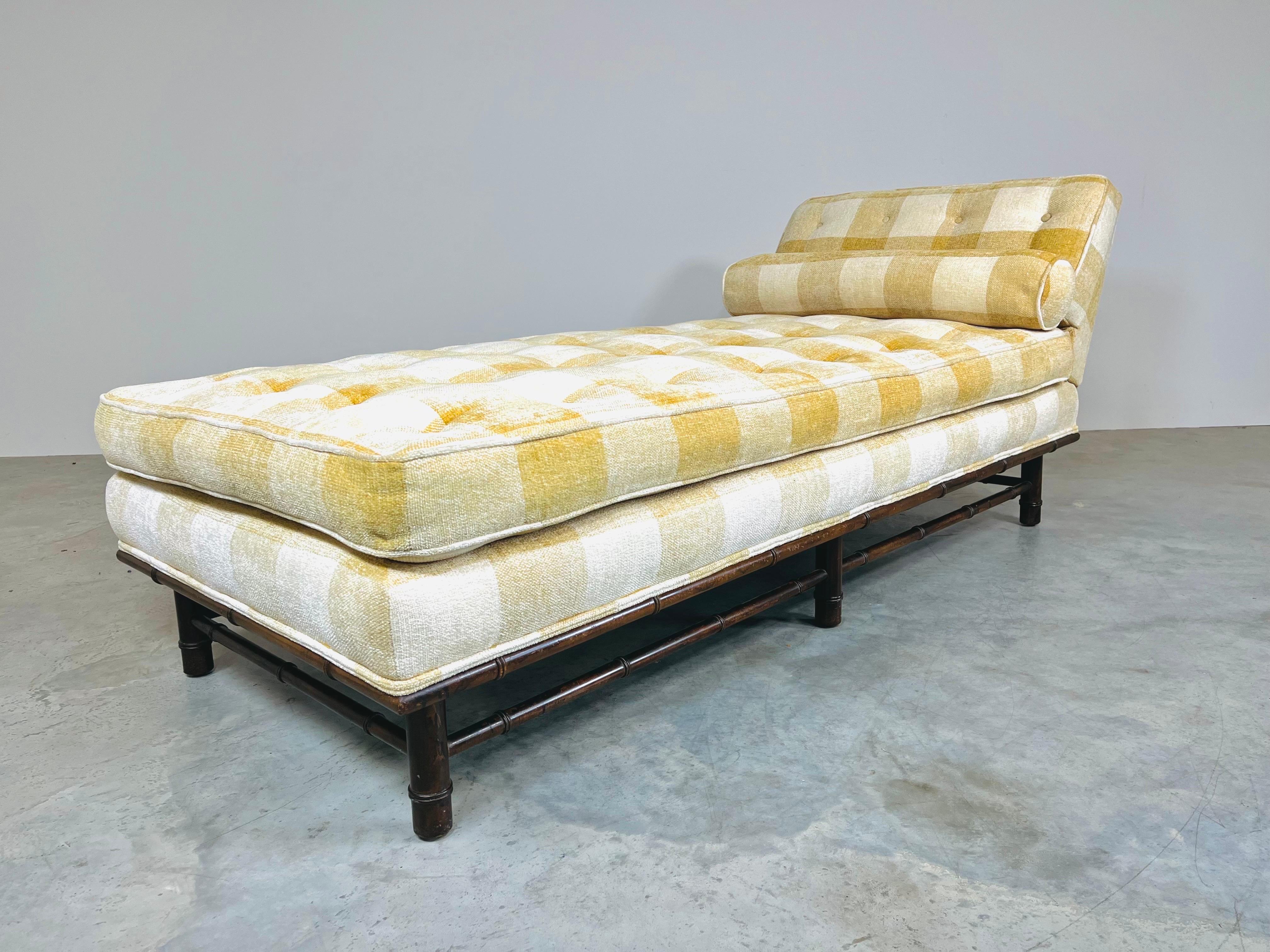 A beautiful adjustable daybed chaise in the manner of T.H. Robsjohn Gibbings having turned walnut faux bamboo elements and soft supple chenille fabric. The mattress cushion features spring frame wrapped in cushioning for soft yet firm support. It is