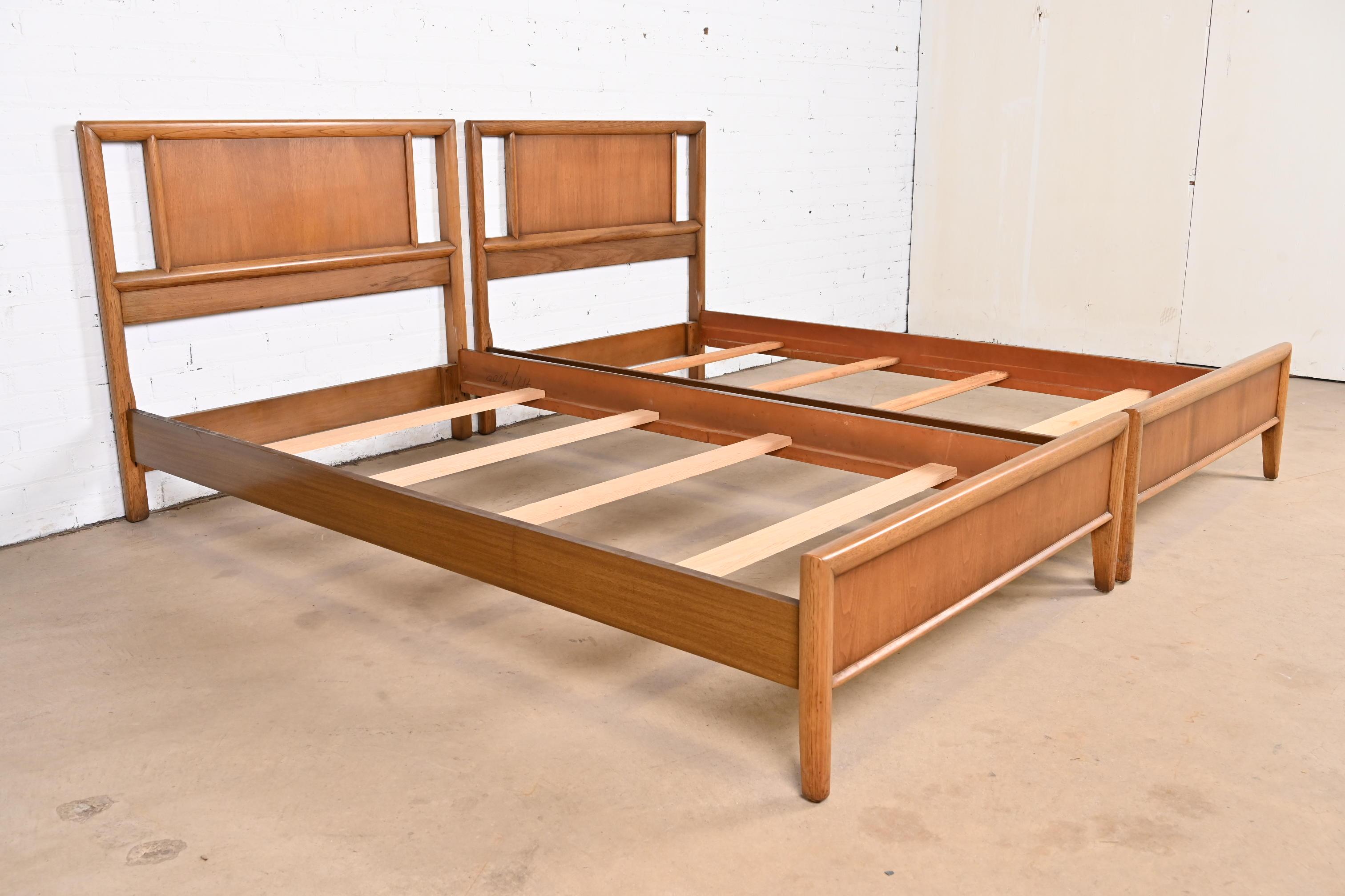 20th Century T.H. Robsjohn-Gibbings Style Mid-Century Modern Sculpted Walnut Twin Beds, Pair