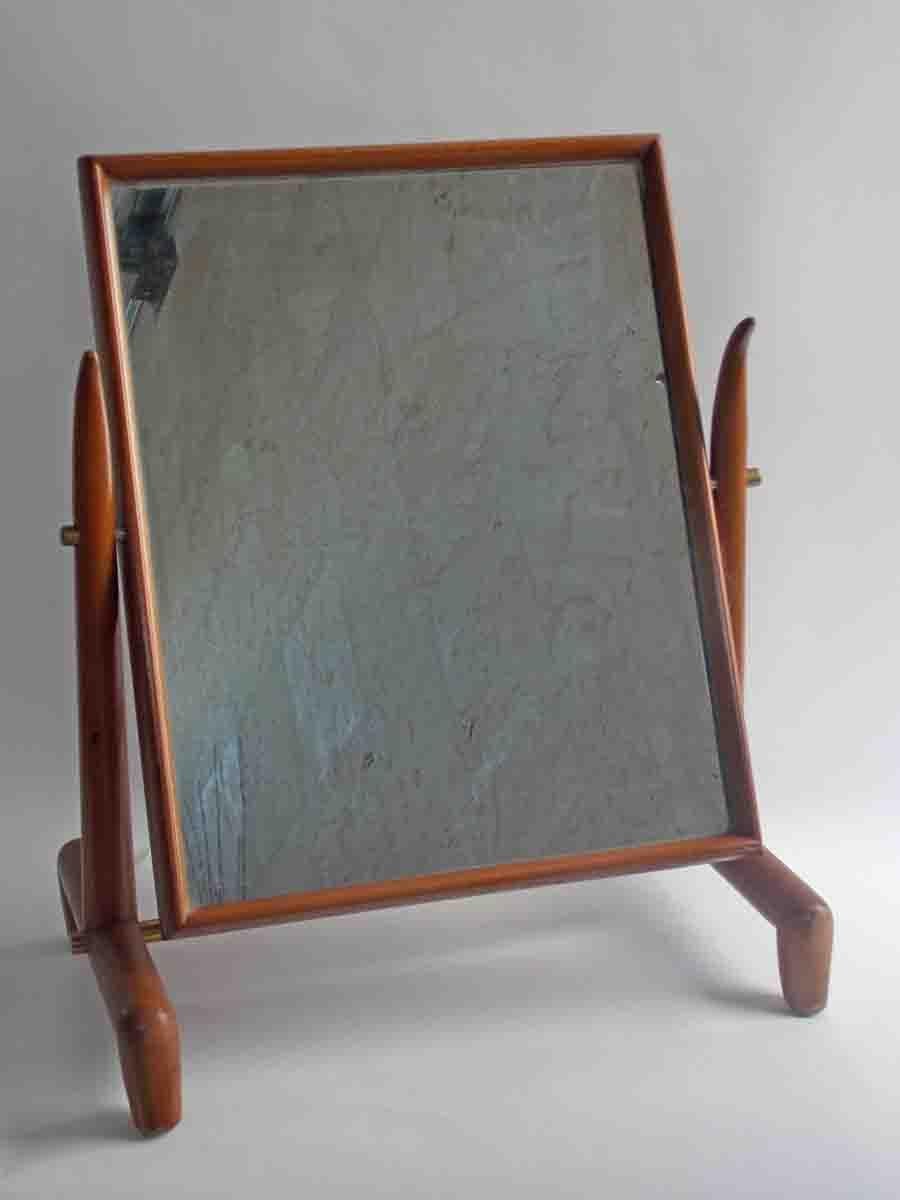 TH Robsjohn-Gibbings table mirror manufactured by Widdicomb
Walnut and brass.