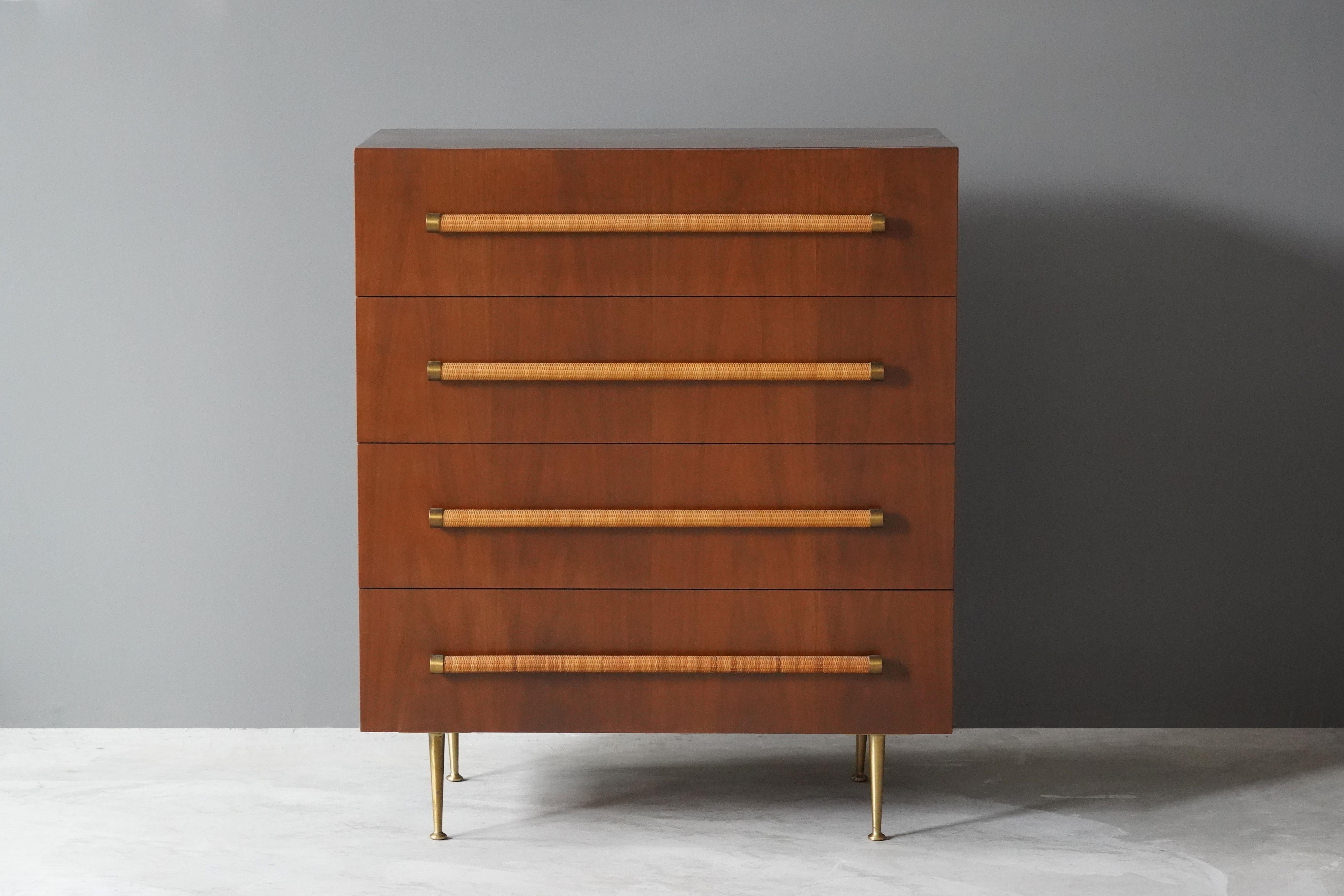 An elegant and practical chest of drawers with brass/rattan grips and brass legs. From the celebrated series of furniture T.H. Robsjohn-Gibbings designed for Widdicomb Furniture Company. 

Robsjohn-Gibbings was active in the same era as Paul