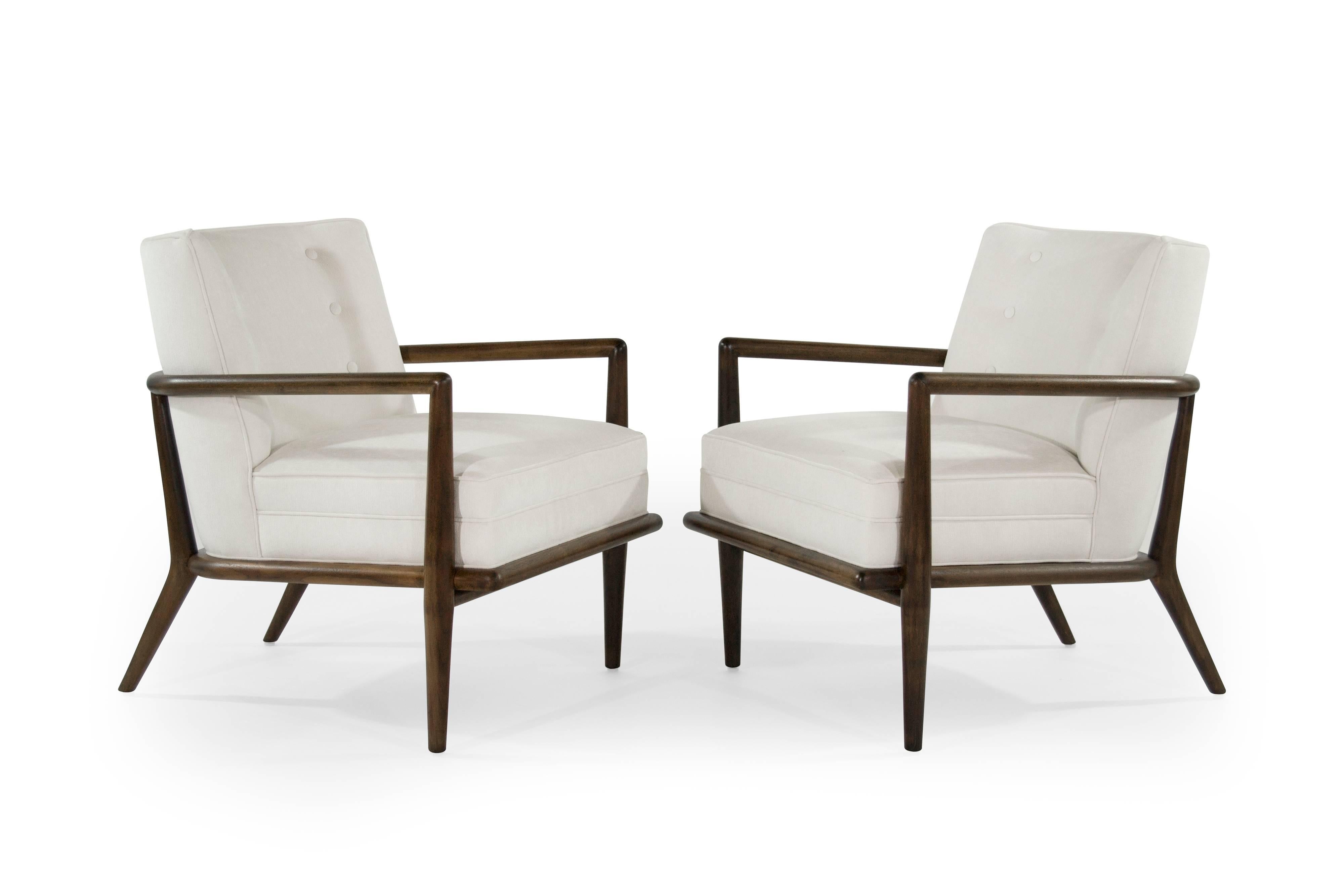 Rare set of walnut tub lounge chairs designed by T.H. Robsjohn-Gibbings for Widdicomb, circa 1950s. Sculptural walnut frames has been fully restored, as well as re-upholster in a soft off-white velvet.