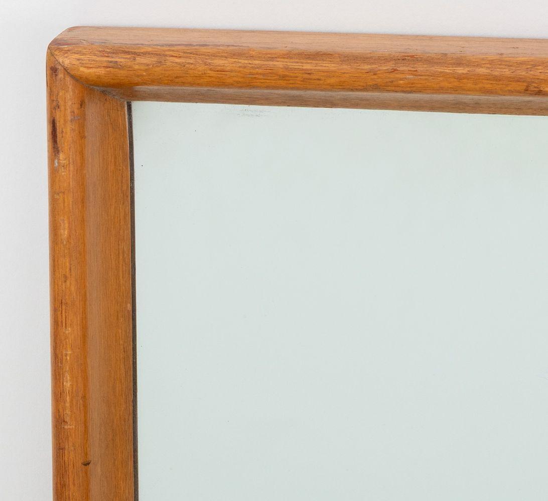 T. H. Robsjohn-Gibbings Mid-Century Modern Walnut Wall Mirror, 20th century. Mirror: 49.5