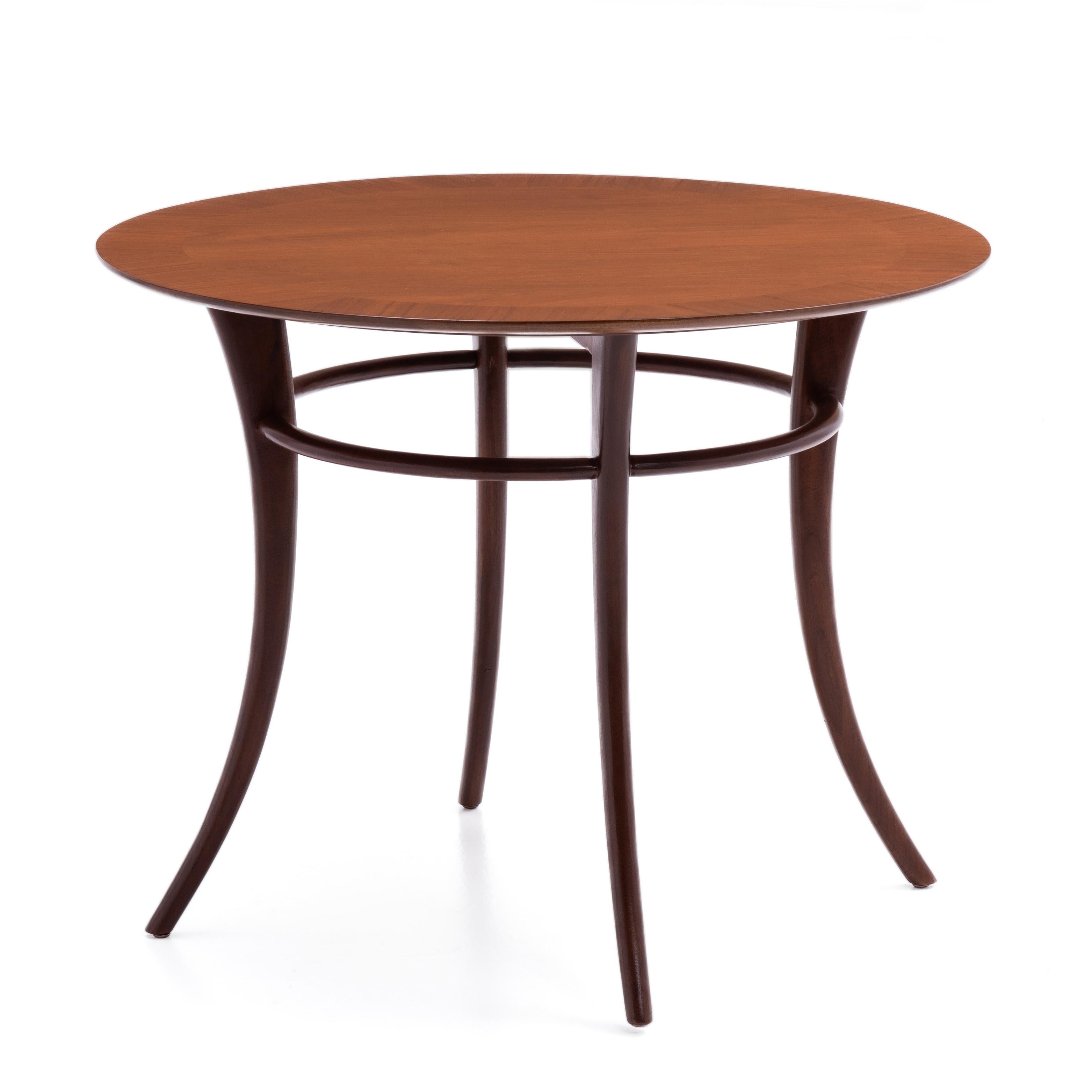 A versatile Klismos or Saber Leg table designed by T.H. Robsjohn-Gibbings for Widdicomb. The legs are slightly darker than the top. This form works well as a lamp, side or end table. Fully marked, made in 1955.