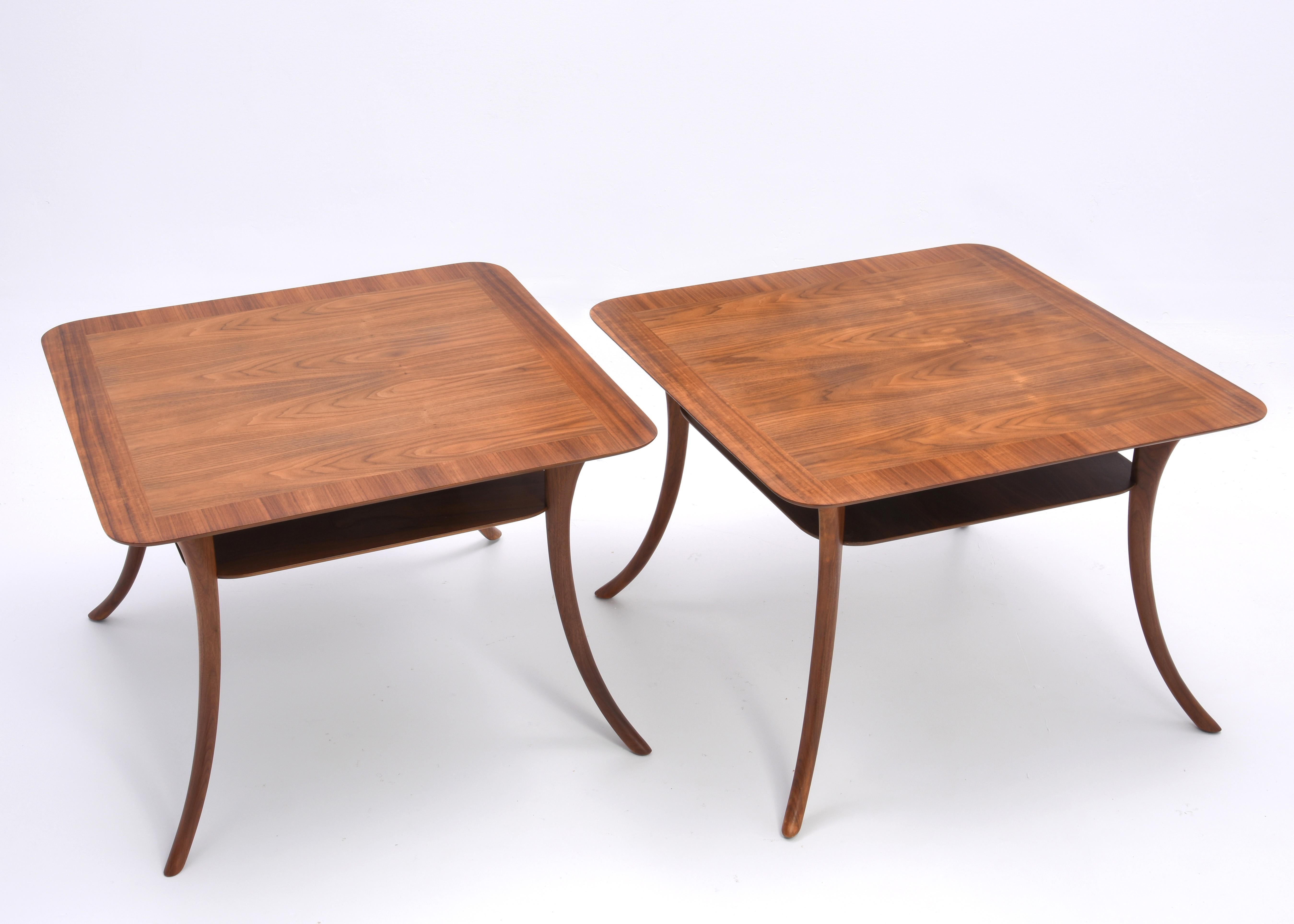 An absolutely gorgeous pair of T.H. Robsjohn Gibbings for Widdicomb side or cocktail tables, ca 1957. Banded and book matched tops. The graceful saber legs are reminiscent of the Klismos chair.