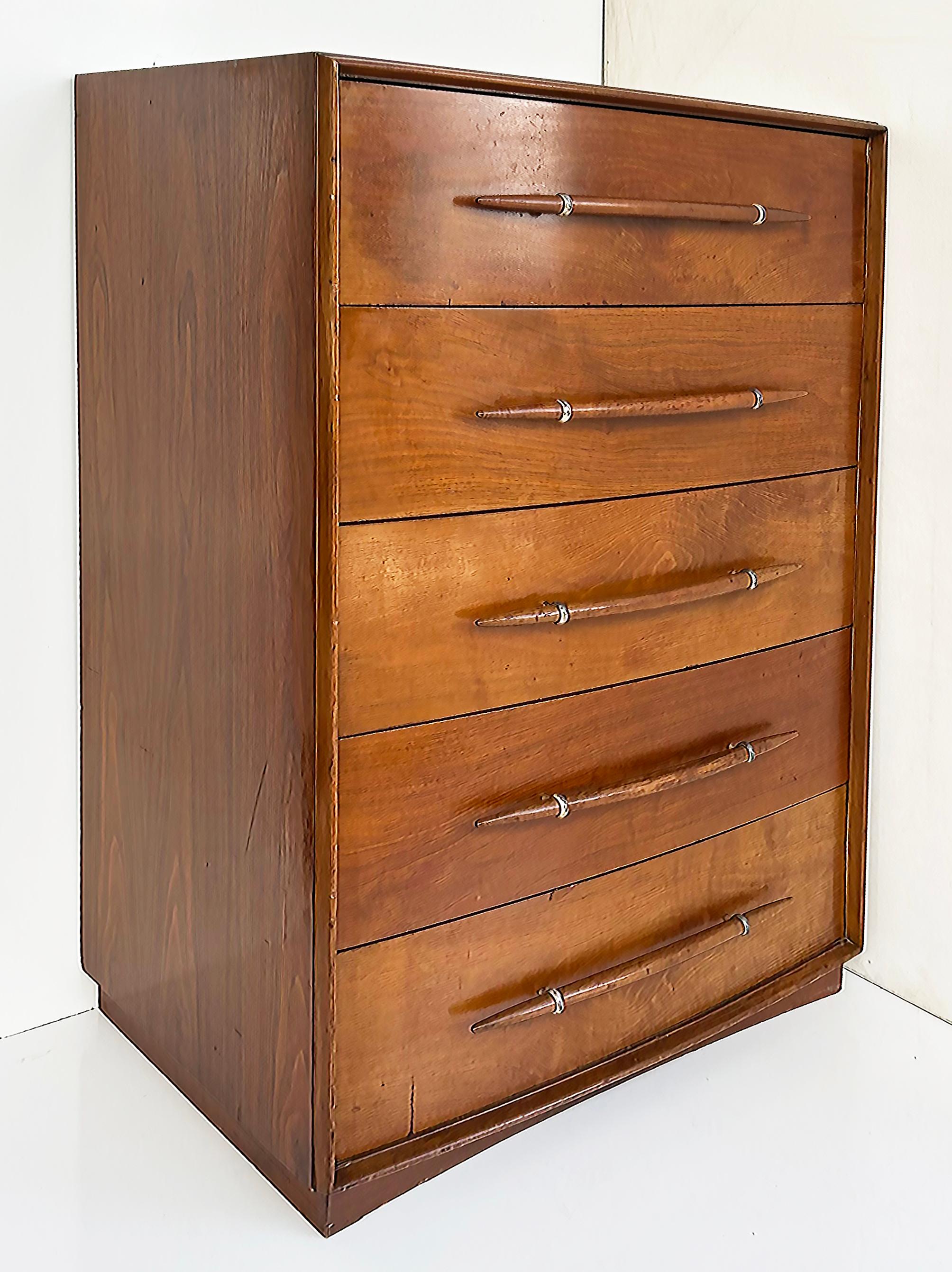 T.H. Robsjohn-Gibbings Widdicomb Tall Walnut Dresser with Spear-Shaped Handles

Offered for sale is a T.H. Robsjohn-Gibbings for Widdicomb Furniture Company tall five-drawer walnut chest of drawers with stylish spear-form handles.  This chest is in