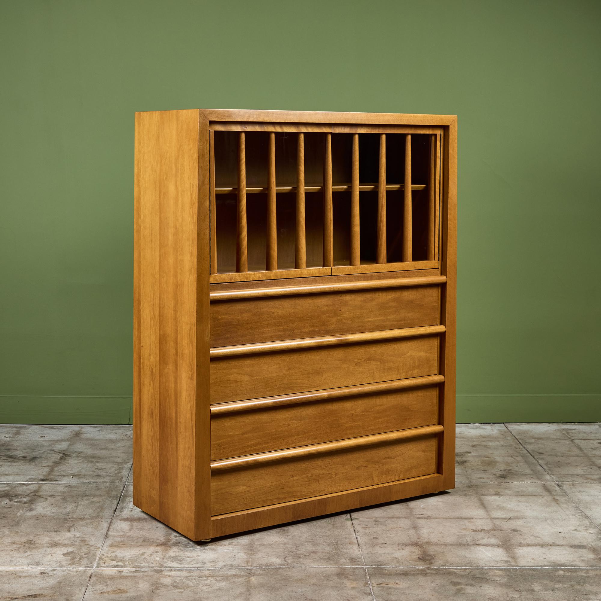 Highboy secretary cabinet by T.H Robsjohn Gibbings, manufactured by Widdicomb c.1950s USA. This beautiful oak cabinet features three drawers with the top drawer front pulling out to showcase a secretary desk and office storage. The top of the