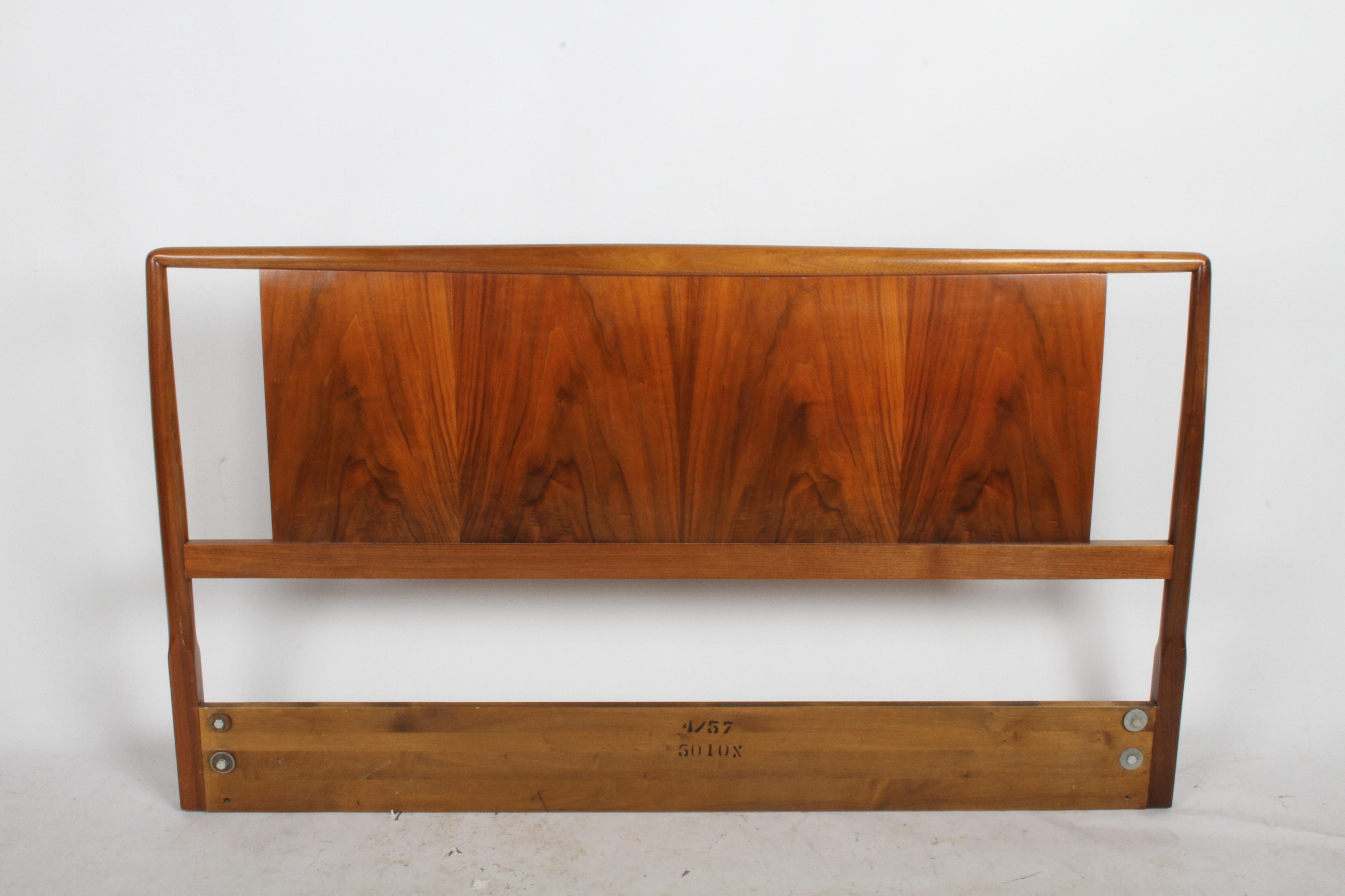 T.H. Robsjohns-Gibbings for Widdicomb full size headboard with book matched walnut. It seems to have been refinished at some point. Shows minor wear. Mounting hardware at 51.25
