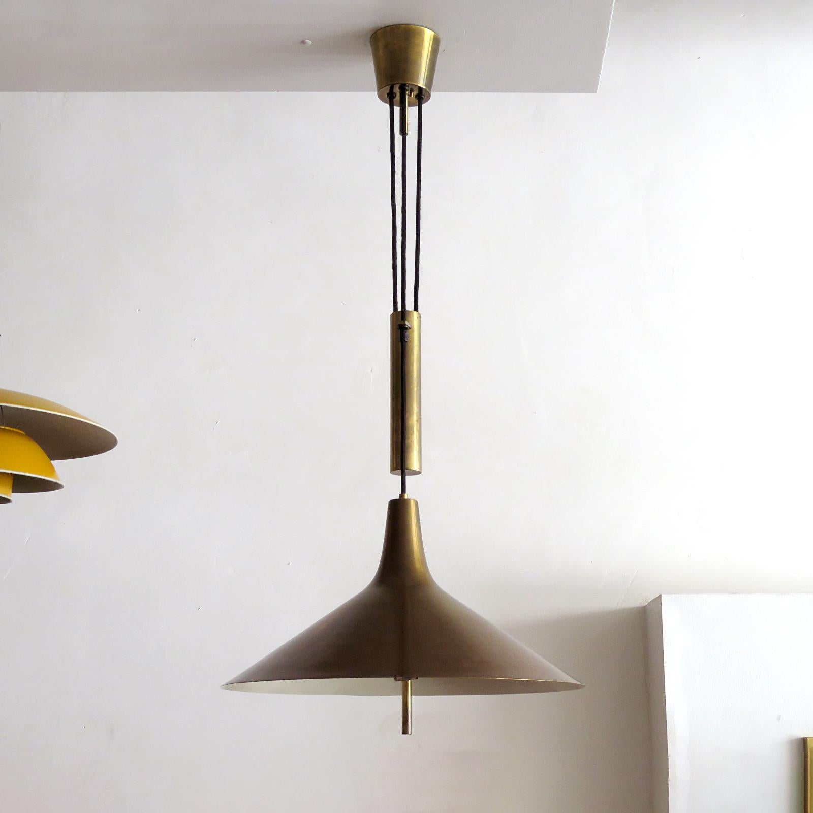 wonderful large brass pendant light 'Fusijama' by Th. Valentier of Copenhagen, Denmark, 1960s, with heavy adjustable counter weight system (height range 40