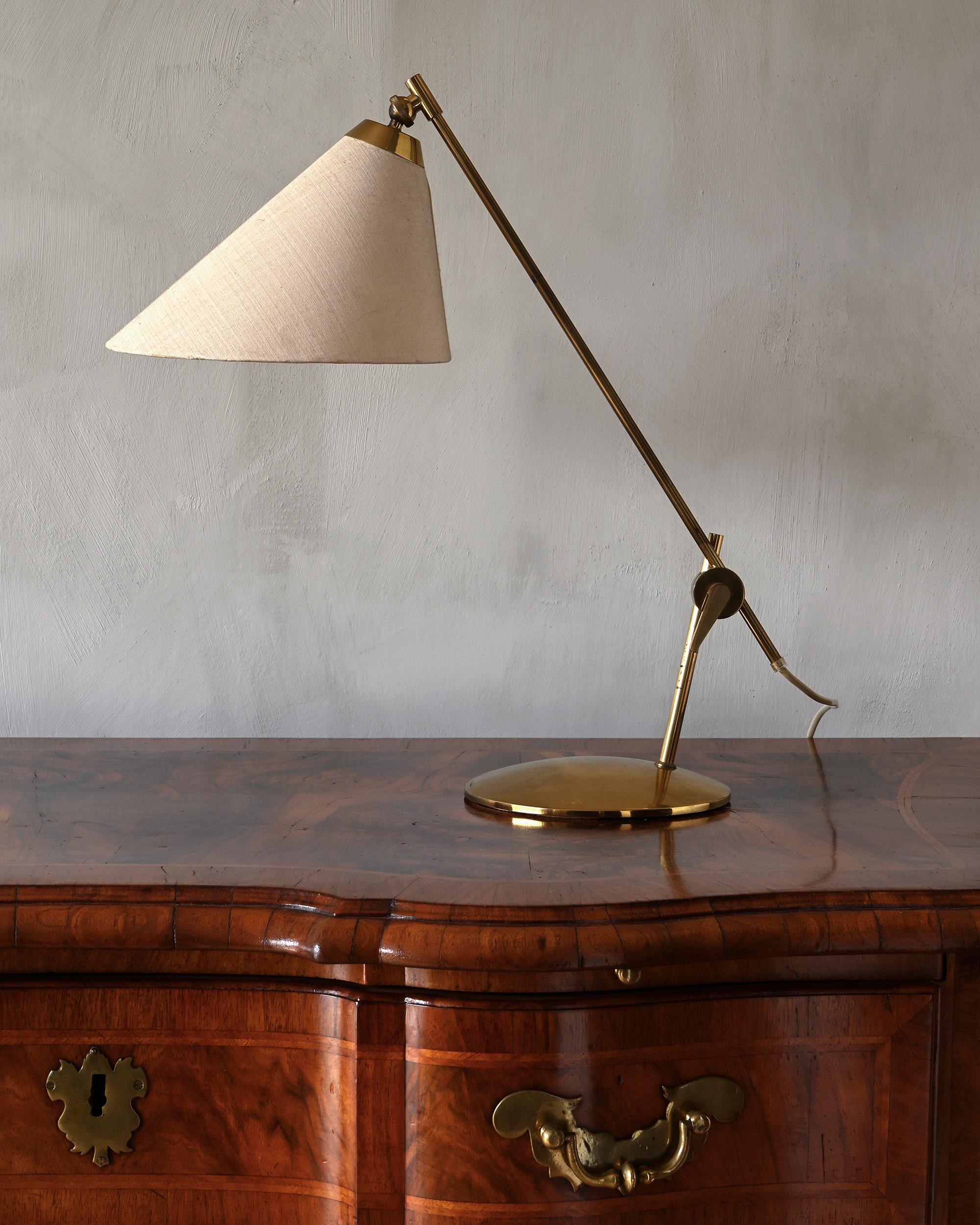 Th. Valentiner adjustable brass table lamp manufactured by Poul Dinesen in 1950s, Denmark.