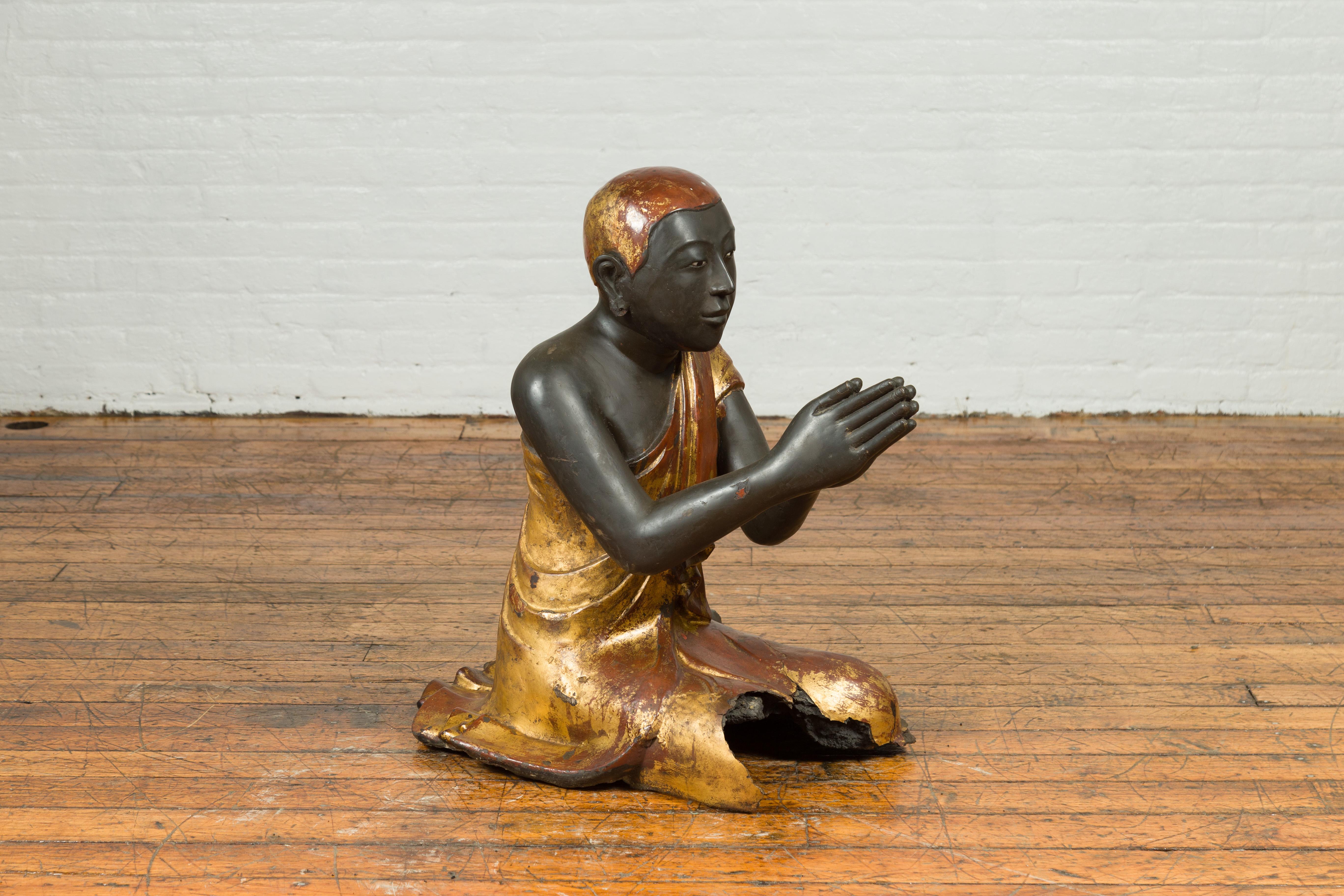 Thai 20th Century Kneeling Ceremonial Temple Monk Lacquered and Gilt Sculpture In Fair Condition For Sale In Yonkers, NY