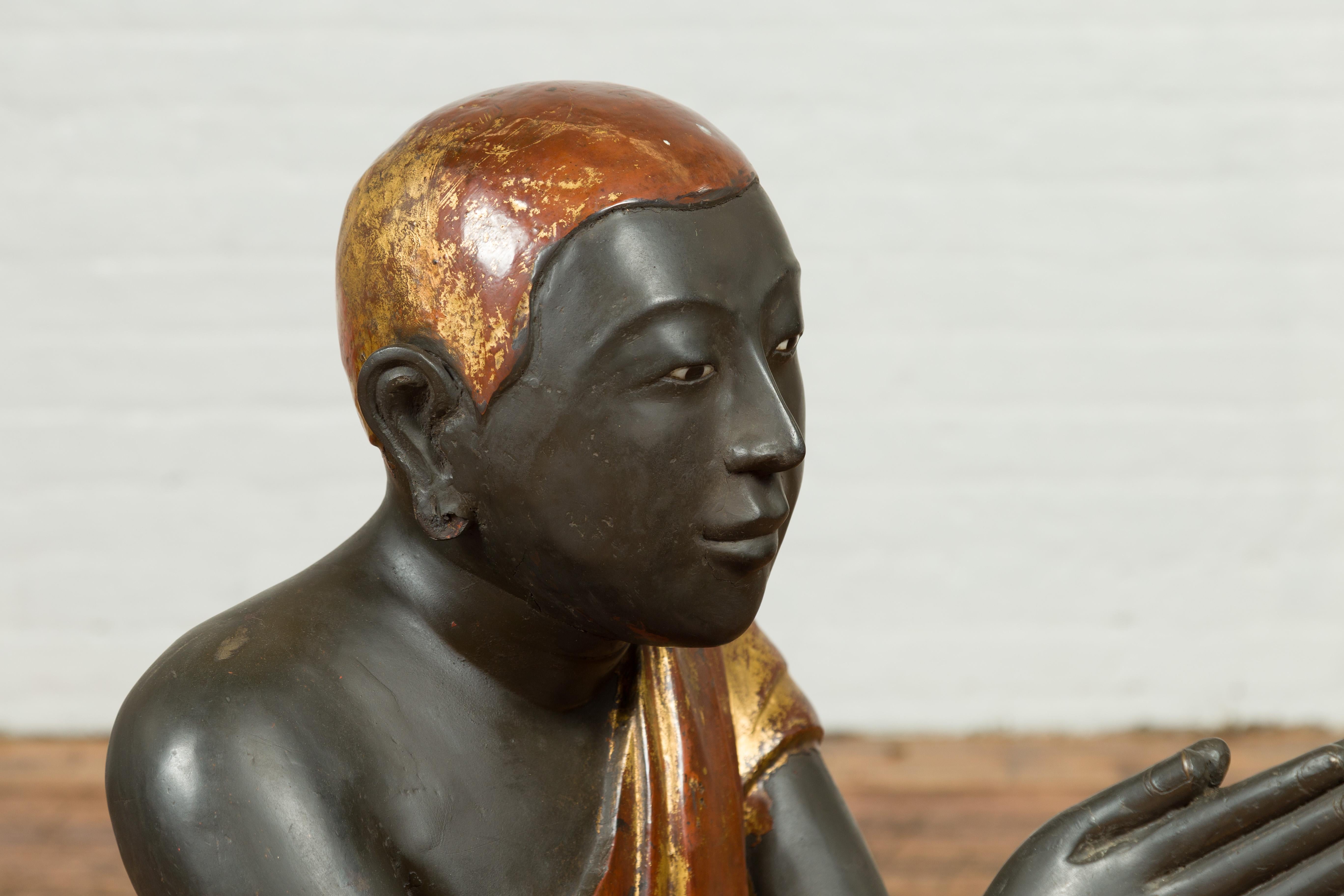 Stone Thai 20th Century Kneeling Ceremonial Temple Monk Lacquered and Gilt Sculpture For Sale