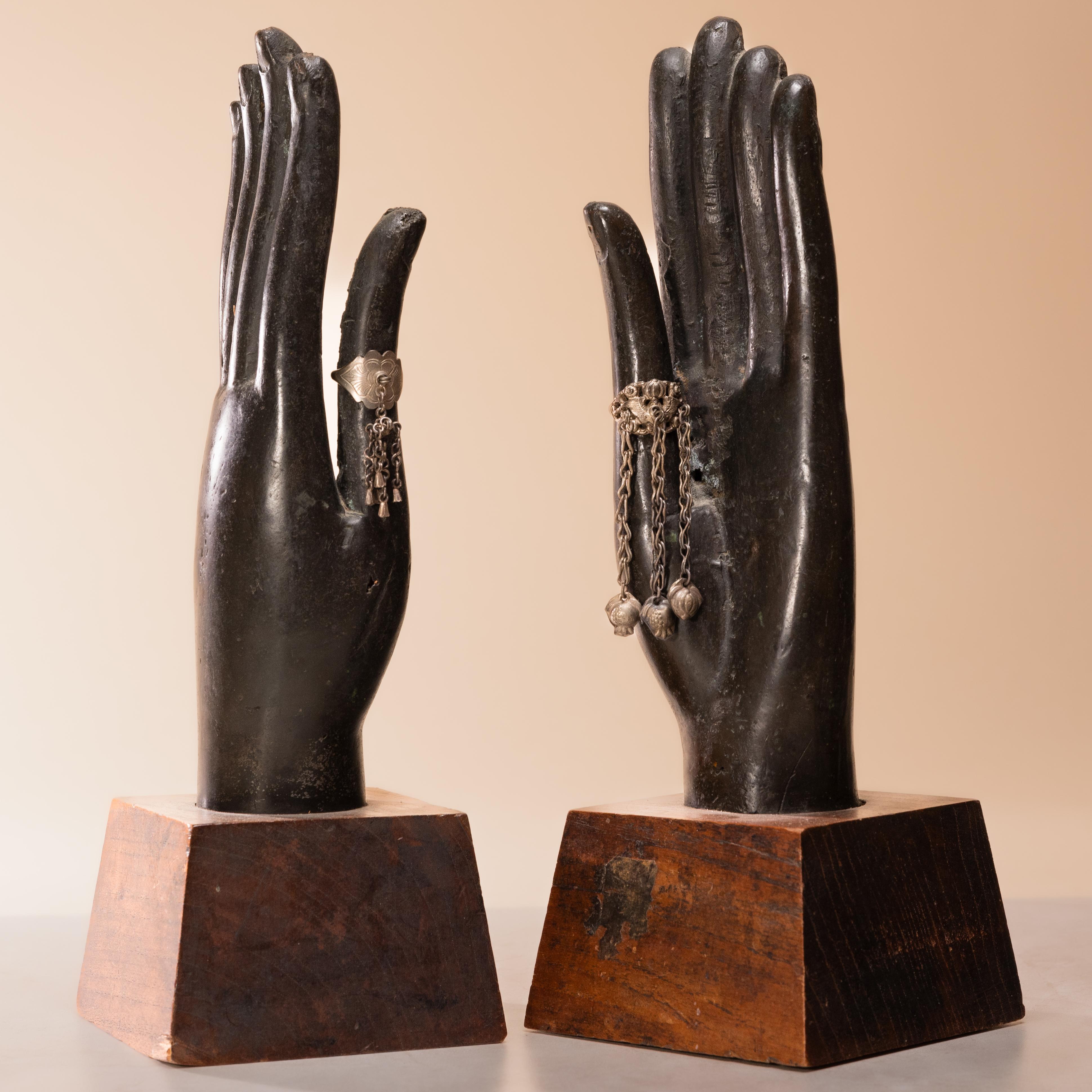 This 19th-century Buddha's hand sculpture from Thailand is finely cast of bronze with lifelike features and a beautiful dark patina. The hand is held upwards in abhaya mudra, the gesture of protection and reassurance. With arms outstretched and
