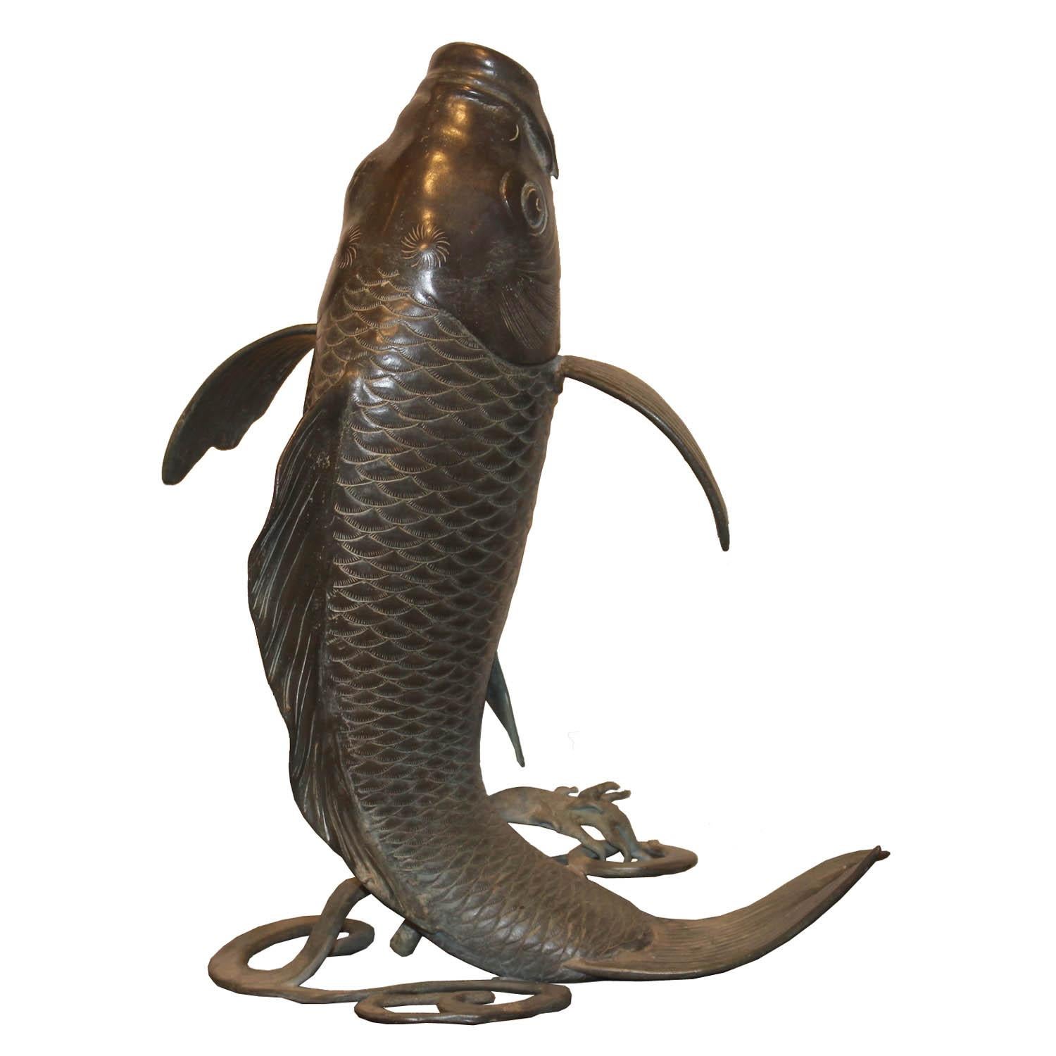 Handmade bronze fish. Originally a fountain with a small opening in the mouth for water to spout from and a small bronze tube at the bottom for water entry. Use as a small fountain or display on a coffee table or on a book shelf.