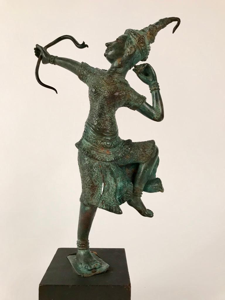 Bronze statue depicting Rama as an Archer. To a Thai or Burmese Buddhist it represents the importance of wisdom, effort, patience and concentration on the journey to bliss. The statue is well executed, it has lovely lines and is balanced visually