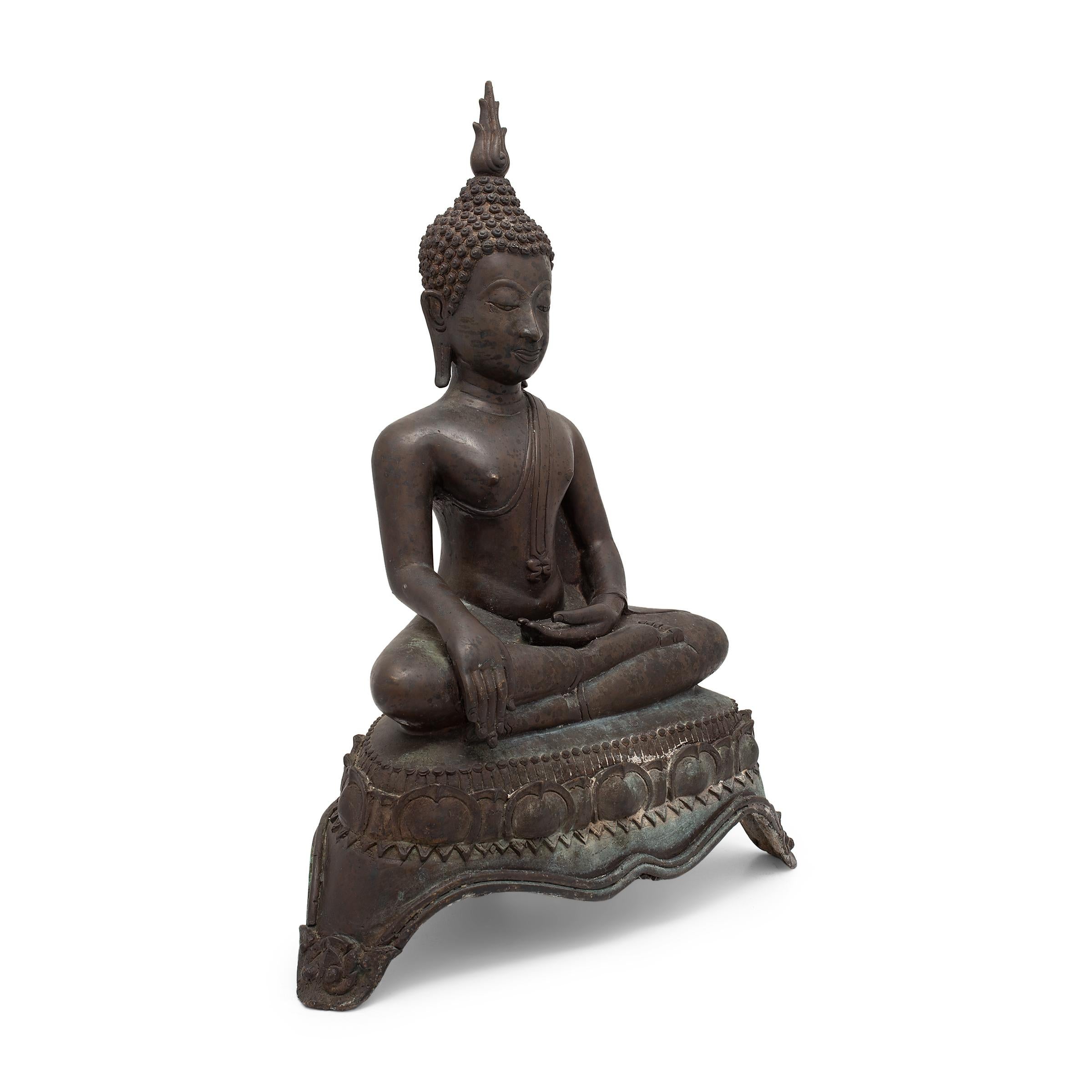 This cast bronze figure dates to the 19th century and depicts the Buddha Shakyamuni in perpetual meditation. Also known as Shaka or Siddhartha Gautama, Shakyamuni is revered as a fully enlightened being and the source of all Buddhist teachings and