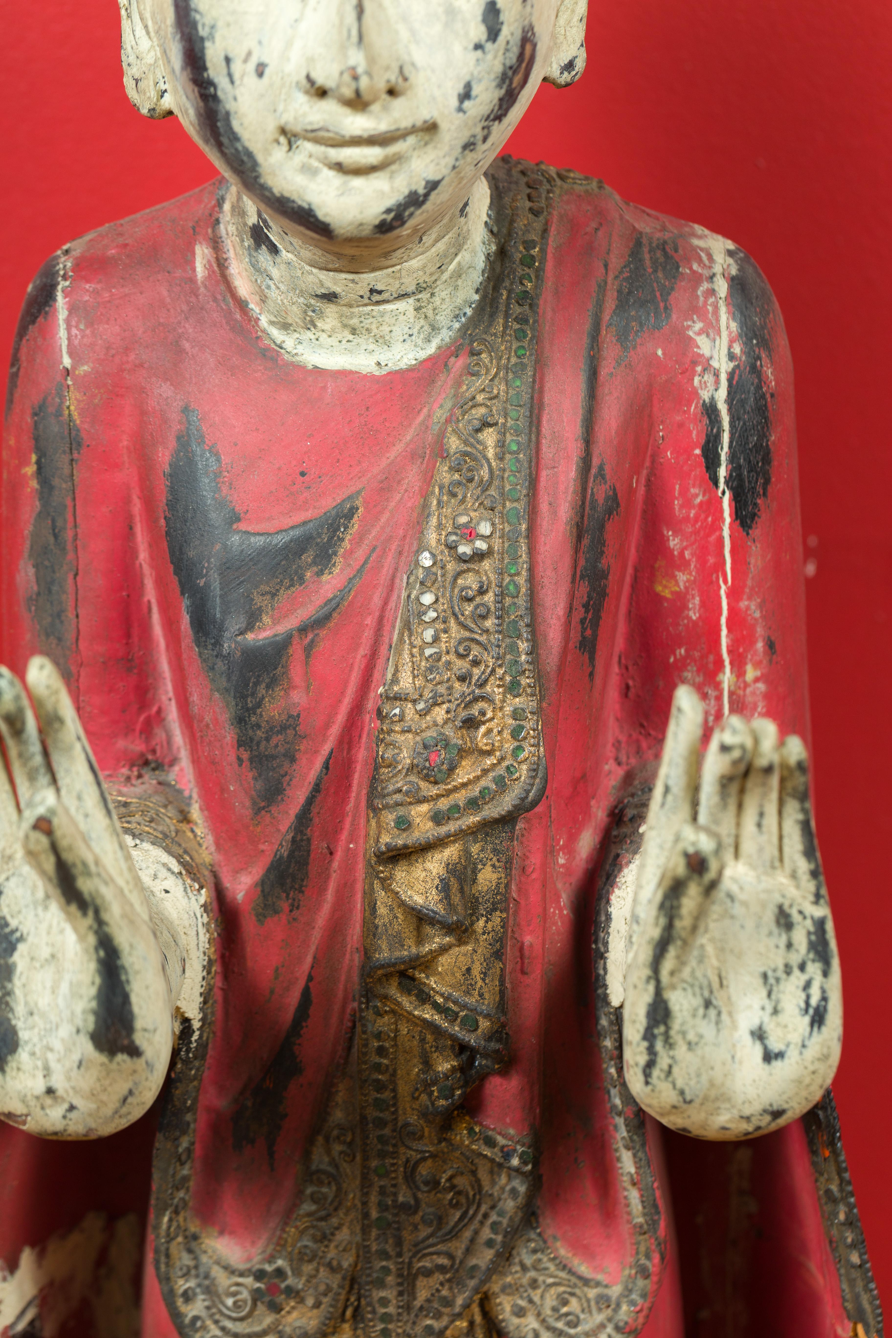 20th Century Thai Carved and Painted Wooden Monk Statue with Dispelling of Fear Gesture For Sale