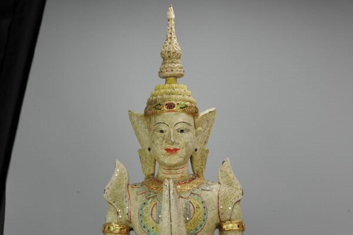 Huge and beautifully carved statue thai dancer

Additional information:
Material: Wood / Bamboo
Region of Origin: South East Asia
Period: 20th century
Condition: Good with some ware. 
Dimensions: 97 cm