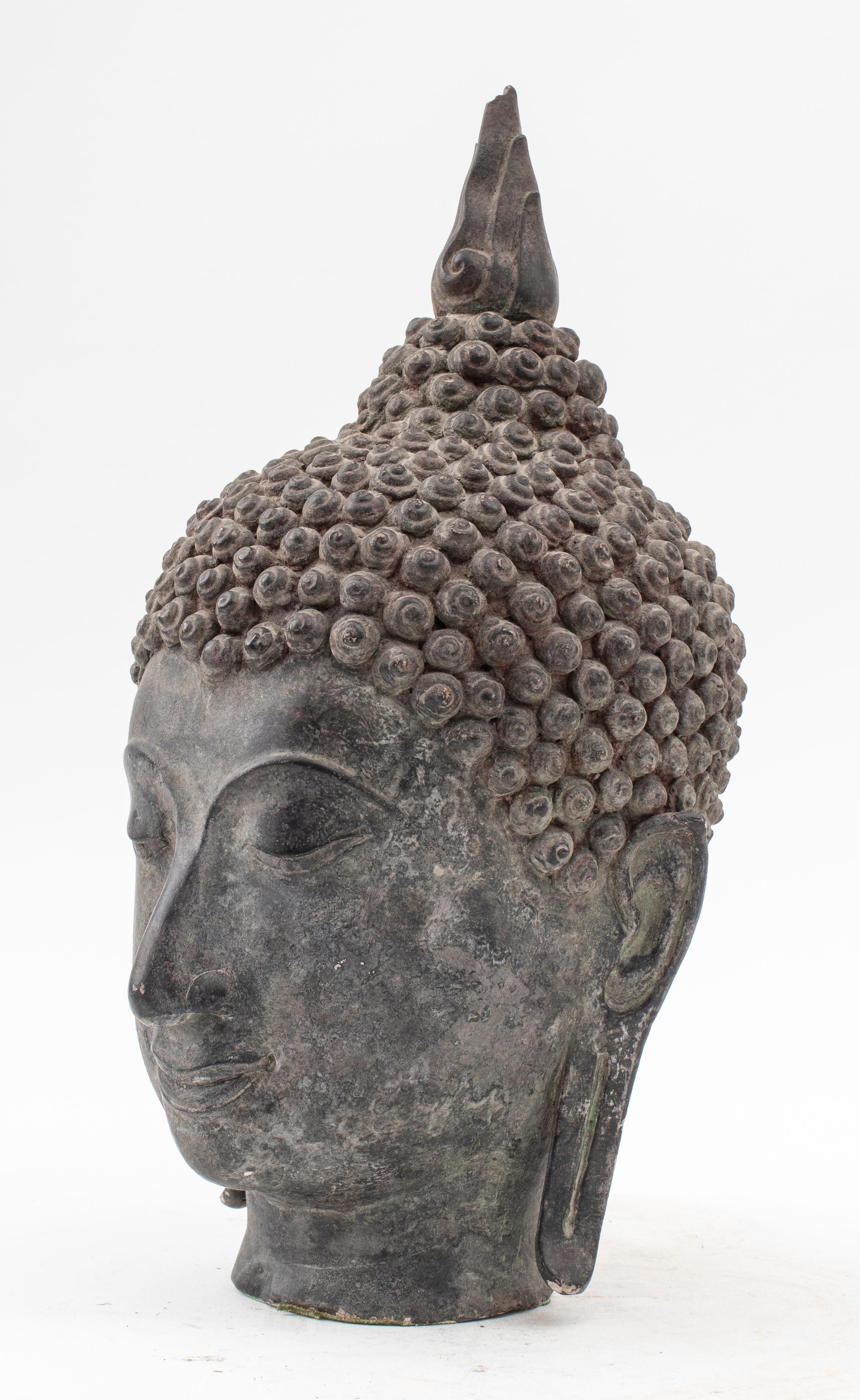 Thai cast stone with bronzed patina Buddha head bust, 19th century. 16.9